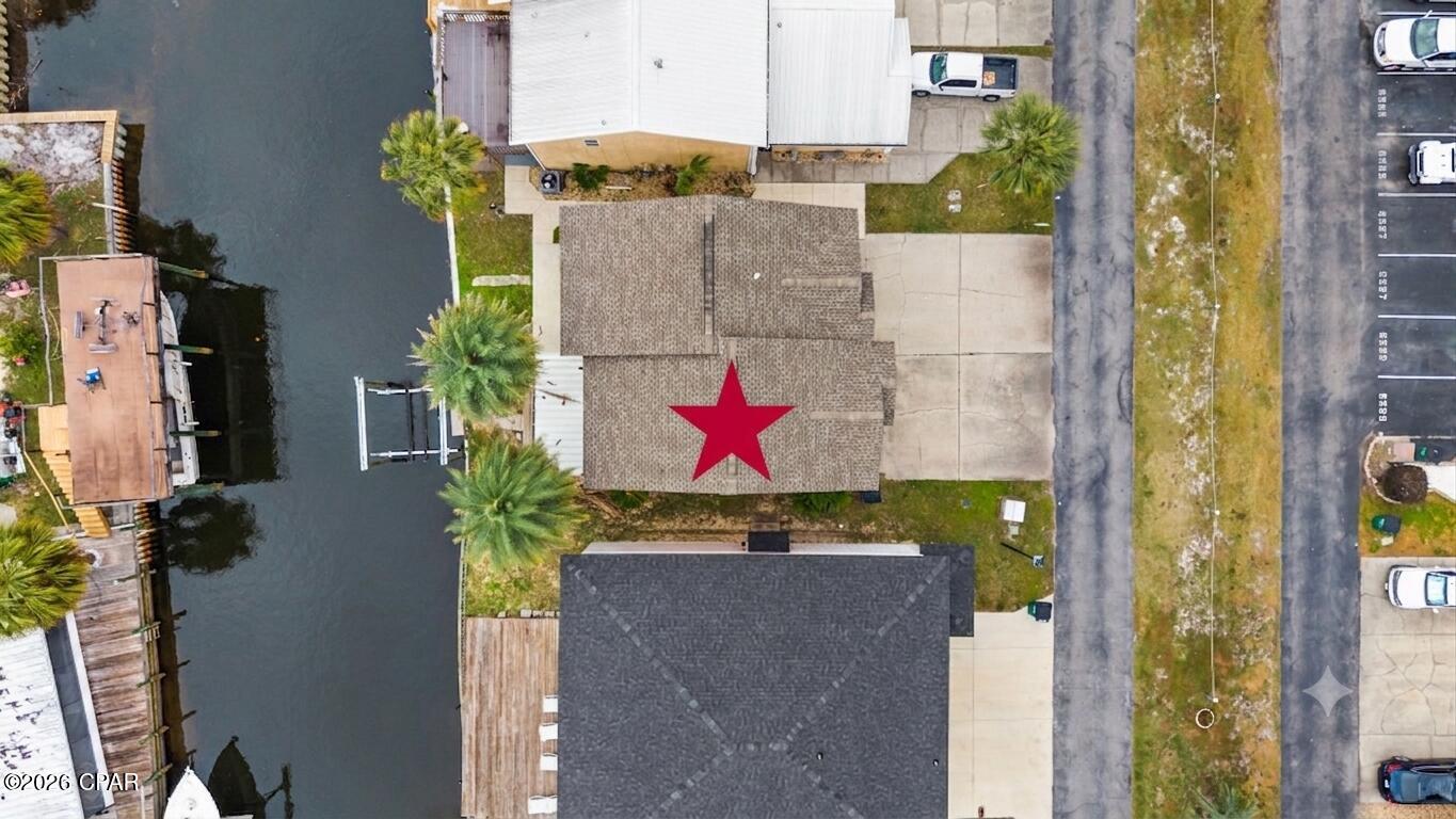 Bring your BOAT!!  Fantastic townhome on the canal!  If you are a boater, you need to come see this home!  There is a new 6000 lb boat lift with remote control and deck.  Just a short boat ride to the bay and the beautiful Gulf!  This 2 bedroom 2 1/2 bath townhome is in a great location.  Close to beaches and to town.  Stainless appliances, new paint, and new flooring.   The roof was replaced in 2020.  There is a great covered porch for you to sit outside,  enjoy the great breezes and relax while being on the water.  You need to come check out this great townhome and get your boat ready to go fishing!

Buyer to verify all measurements if important.