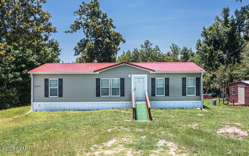 VERY RARE OPPORTUNITY ON ENCONFINA CREEK! This 3 bedroom 2 bath double wide mobile home was Built in 2021 and is in perfect shape! This home boast being waterfront just off of Econfina Creek and Deerpoint lake. Just imagine beautiful sunsets every evening. This home has a new heat pump AC system 2024. The water source is a artesian well,  which is some of the best water in bay county. New metal roof 2024 and a new septic tank 2021. Very close the the David Hutchinson park and   boat landing. There is a outdoor grill and fire pit. located in a quite cul-de-sac . Close to grocery store, hardware store and McDonalds and only 30 minutes to the airport . You only limitation is your imagination.