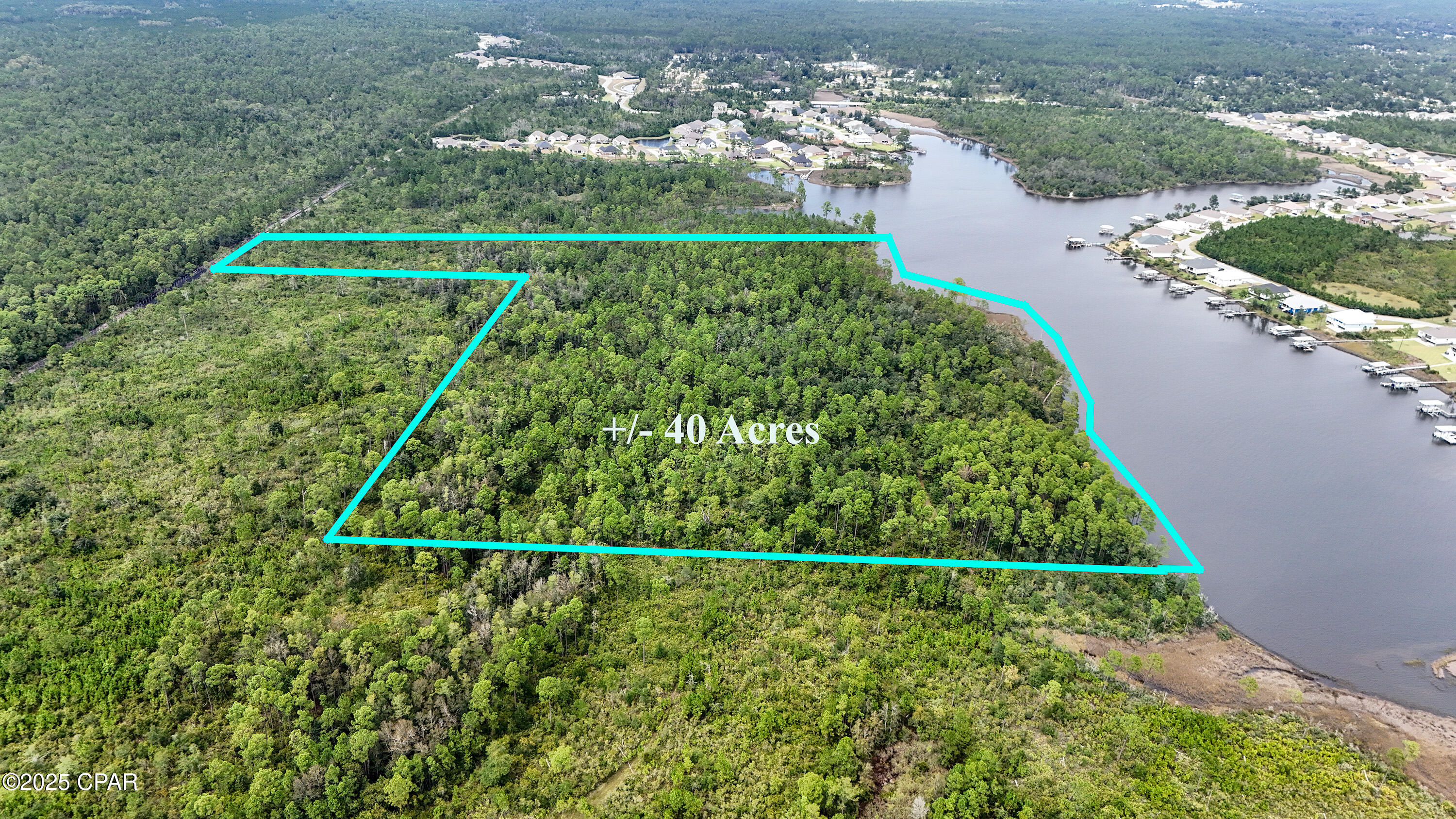 Nestled in the heart of Southport and located next to the tranquil waters of North Bay, this rare 40-acre waterfront property offers a truly unique opportunity. With a deeded easement already in place, this property is ideal for future development. The land features a beautiful mix of mature trees, open clearings, and serene water views, providing the perfect setting for those seeking natural beauty, and endless possibilities. It's minutes from Lynn Haven, Panama City, and the beaches, yet feels a world away. With no HOA, the potential here is as vast as the acreage itself. Opportunities like this are few and far between--don't miss your chance to own a rare piece of waterfront paradise in Southport.