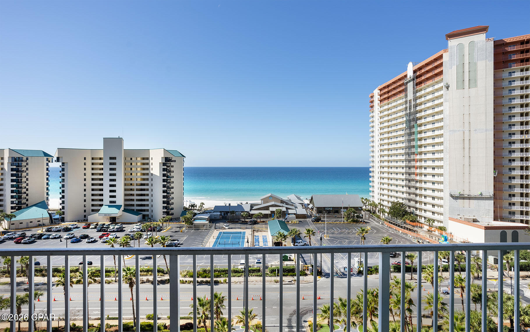 Welcome to Unit 827 at Laketown Wharf Resort! A beautiful 2-bedroom/2-bath condominium with a terrific bunk area offering 1,262 square feet of living space in the heart of Panama City Beach. Perfectly positioned just steps from the world-famous white sandy beaches and emerald waters on the Gulf of America. This spacious residence is ideal as a vacation getaway, investment property, or full-time coastal retreat.

The open-concept floor plan features a large living and dining area that flows onto a private balcony, creating the perfect space to relax and enjoy the coastal breeze. The well-appointed kitchen offers ample cabinetry, generous counter space, and a convenient breakfast bar--ideal for entertaining guests or enjoying family meals after a day at the beach.

The primary suite provides a peaceful retreat with an en-suite bathroom and plenty of space to unwind, while the second bedroom and bunk area make it easy to accommodate additional guests, maximizing the property's strong short-term rental potential.
Owners and guests at Laketown Wharf Resort enjoy an impressive collection of resort-style amenities including multiple pools, a freshwater lake and boardwalk, fitness center, putting green, restaurants, and nightly fountain and light shows. Located directly across from the beach and within walking distance to dining, entertainment, and shopping, this resort offers the ultimate Panama City Beach lifestyle.  Contact your favorite Realtor today and come take a look!