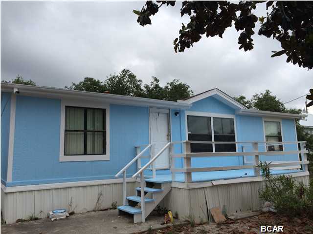 With in walking distance to the beach on the West end. This is a 3 bedroom 2 bath mobile home with split bedroom floor plan and large deck out front.
