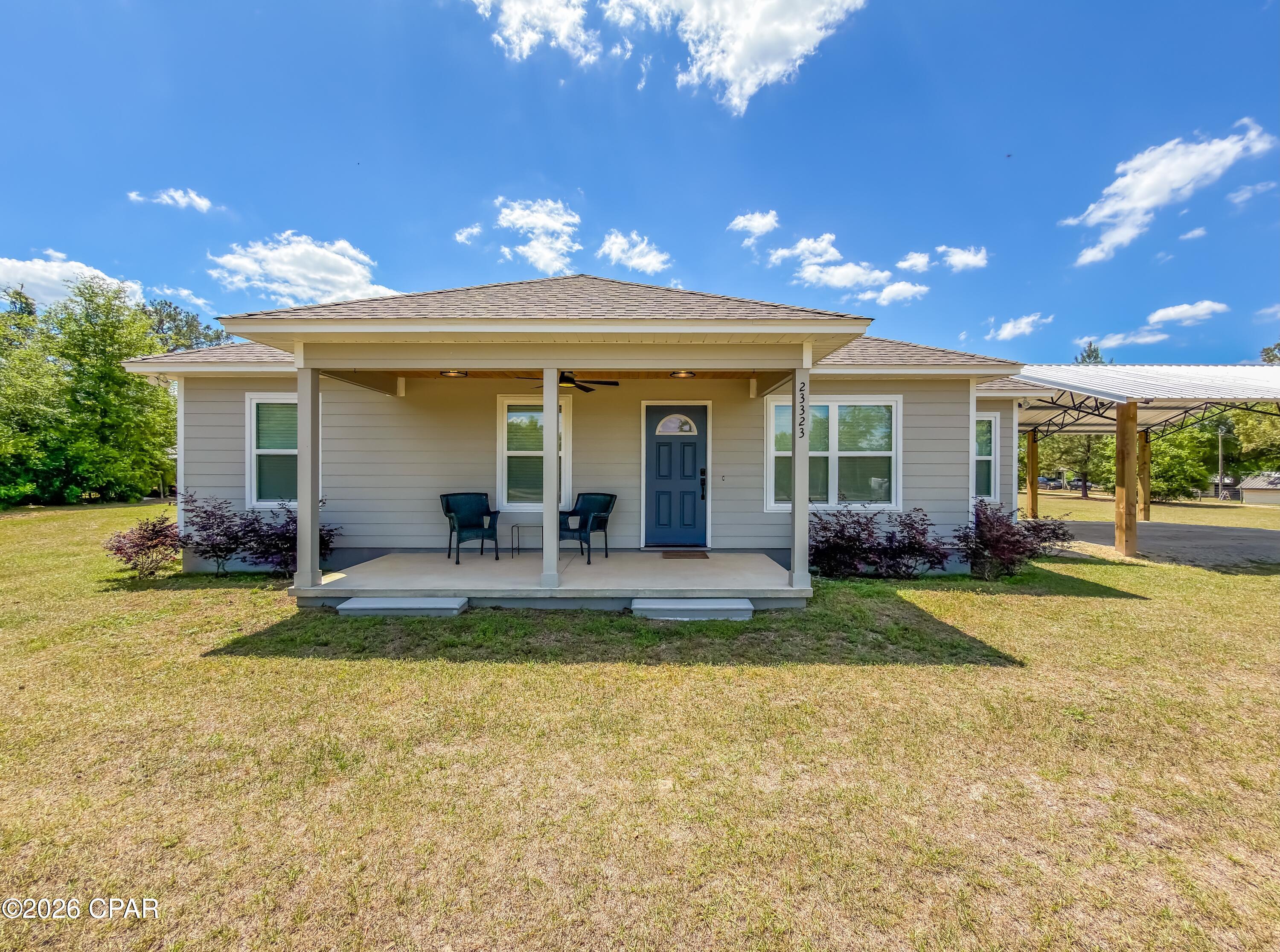 CURRENTLY UNDER CONTRACT, SELLER WILL CONSIDER BACKUP OFFERS

Welcome to country living at 23323 NW Blackbottom Road in Altha, Florida. Built in 2024, this beautifully designed 3-bedroom, 2-bath home sits on 2.71 acres and offers the space, comfort, and modern finishes buyers are looking for.
Step inside and you'll notice the bright, open layout filled with natural light. The spacious living room features tray ceilings, recessed lighting, and a sleek electric fireplace that creates a warm and inviting space to relax or gather with family and friends. The kitchen is both stylish and functional, with white cabinetry, granite countertops, stainless steel appliances, and plenty of storage for everyday living and entertaining.
The primary suite offers a comfortable retreat with a private ensuite bath, creating the perfect place to unwind at the end of the day. The additional bedrooms provide flexibility for guests, hobbies, or a home office.
Outside, the property gives you room to spread out and enjoy the outdoors. Start your mornings on the covered front porch and wind down in the evenings on the large covered back patio with wood plank ceilings and wide-open views of your acreage. The detached carport adds convenient covered parking, while the pole barn and enclosed shed provide extra space for storage, equipment, hobbies, or weekend projects.
Located about an hour from Panama City, Mexico Beach, and Dothan, Alabama, this home offers a great balance of country living with convenient access to the coast, shopping, dining, and nearby towns.
With room to enjoy the land, space for your toys and tools, and the benefits of a newer home with modern finishes, this property offers the best of country living. Schedule your private showing soon and come see all that 23323 NW Blackbottom Road has to offer.