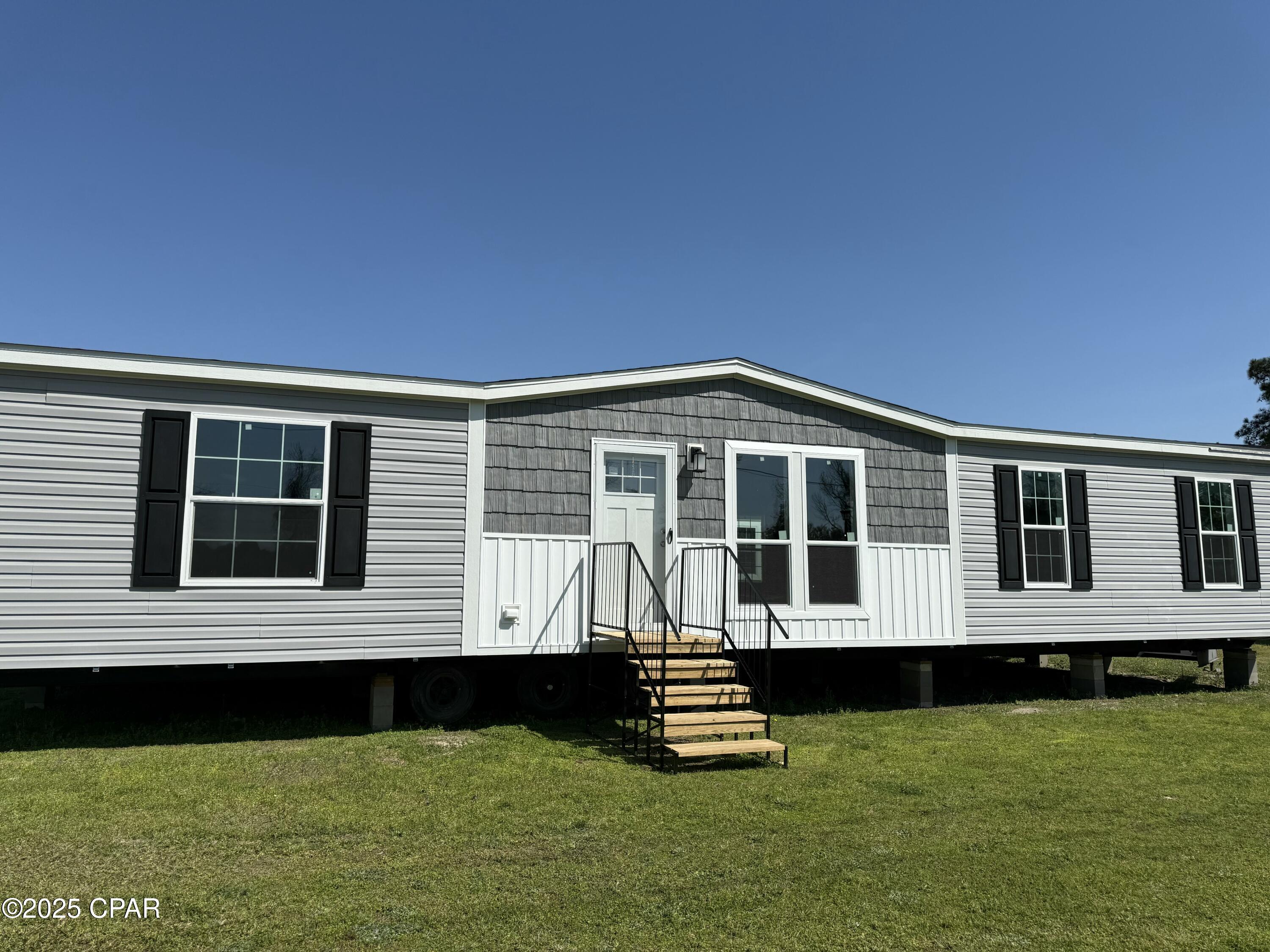 Welcome to your new home at 697 Son in Law Road in Bonifay! This brand-new mobile home is now on-site and ready for its new owner, offering a fresh start with modern style and comfortable living on a spacious 0.5-acre lot. Step inside to an inviting open-concept layout that seamlessly connects the living room, dining area, and kitchen--perfect for everyday living and entertaining. The kitchen features contemporary cabinetry, stylish countertops, and energy-efficient appliances designed to meet all your needs.

The home offers three generously sized bedrooms, each with ample closet space and large windows that fill the rooms with natural light. The master suite provides a relaxing retreat, complete with a walk-in closet and a private en-suite bathroom featuring a double vanity. Energy-efficient upgrades, including low-E windows and quality insulation, enhance both comfort and affordability. Don't miss this opportunity to own a move-in ready, modern home in a convenient Bonifay location!.
