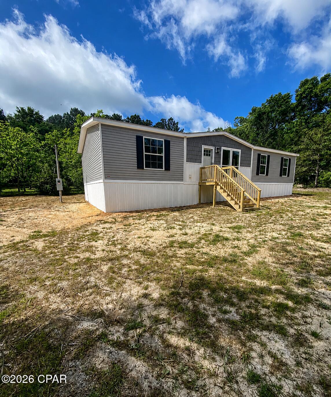 Welcome to your new home at 697 Son in Law Road in Bonifay! This brand-new mobile home is now on-site and ready for its new owner, offering a fresh start with modern style and comfortable living on a spacious 0.5-acre lot. Step inside to an inviting open-concept layout that seamlessly connects the living room, dining area, and kitchen--perfect for everyday living and entertaining. The kitchen features contemporary cabinetry, stylish countertops, and energy-efficient appliances designed to meet all your needs.

The home offers three generously sized bedrooms, each with ample closet space and large windows that fill the rooms with natural light. The master suite provides a relaxing retreat, complete with a walk-in closet and a private en-suite bathroom featuring a double vanity. Energy-efficient upgrades, including low-E windows and quality insulation, enhance both comfort and affordability. Don't miss this opportunity to own a move-in ready, modern home in a convenient Bonifay location!.