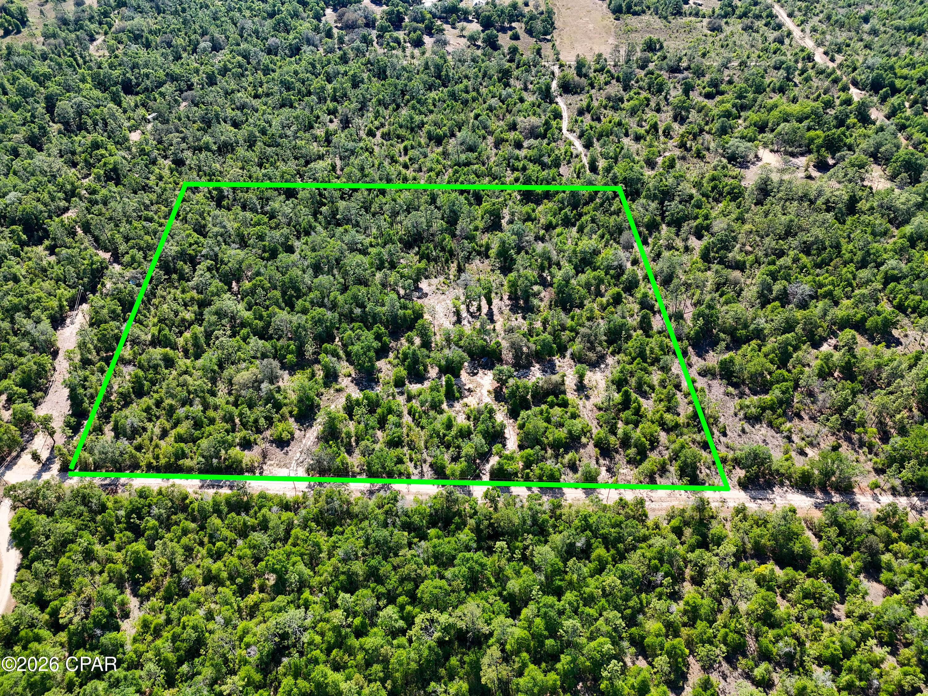 This large property has No wetlands or flood zone and is located one hour from multiple Gulf beaches and beach-towns. It is zoned Agricultural-Residential, and per Bay County there is no minimum size, allowing for mobile, modular, and site build homes. Partially Improved land that is perfect for your dream home, small farm, or homestead!  Save Thousands on improvements already done, including electricity on property, a well for a reliable water supply, circular drive cleared, and gate at drive entrance. Electricity has been brought onto the land through an aerial line, complemented by a dedicated 250' underground supply line leading to a secondary power pole. 

This is where to live if you want Privacy, Serenity, Relaxation, and Fun! Many outdoor activities to enjoy, such as National and State Forests, Wildlife Refuges, Trailheads, Rivers and the Gulf for fishing and boating, off-road parks and a speedway! The town of Fountain is just a few minutes down the road where you can find everyday local amenities.