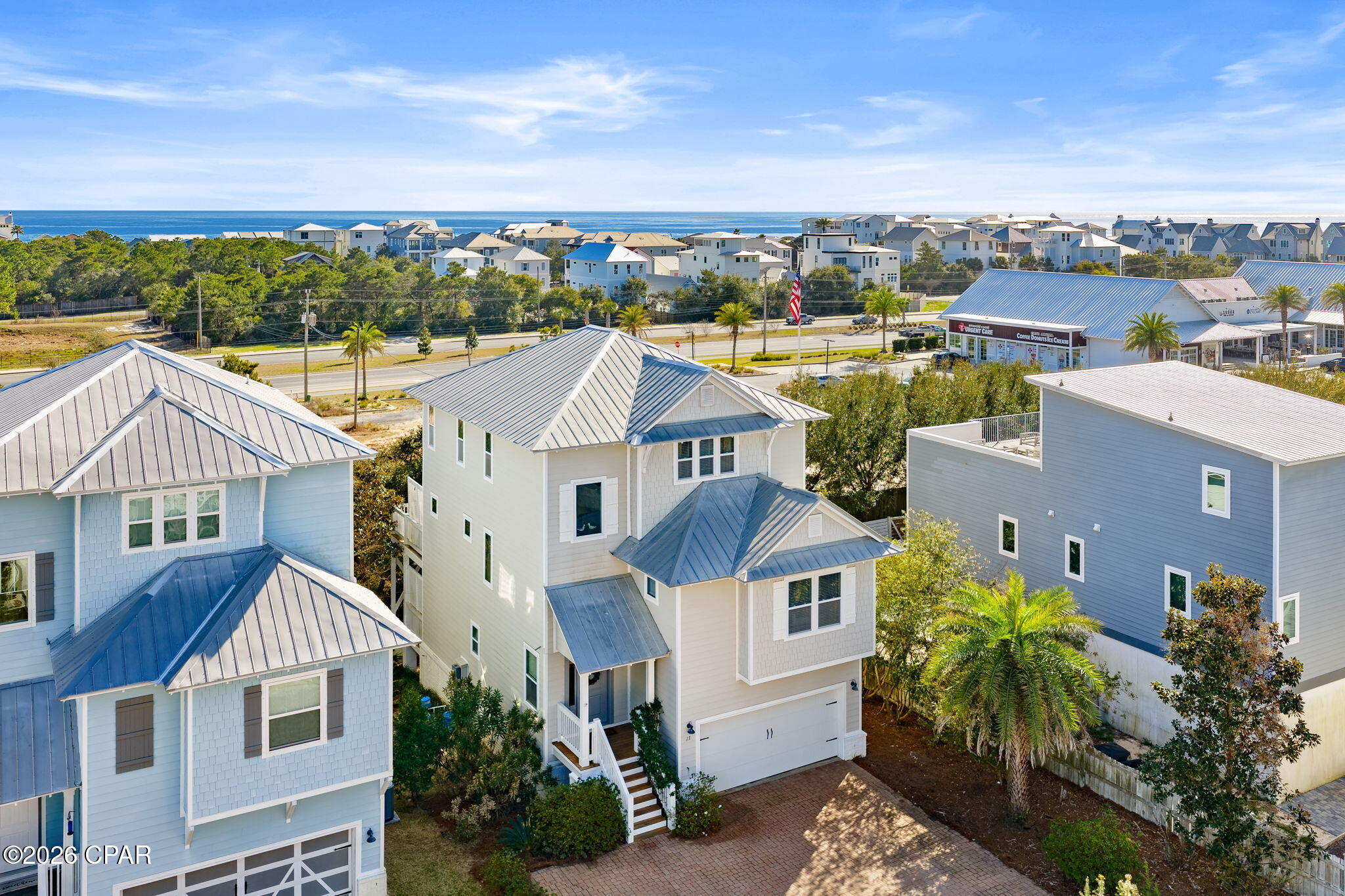 Tucked away in the sought-after Inlet Heights community of Inlet Beach, this beautifully appointed 3-story, 4 bedroom coastal retreat offers the perfect blend of luxury, location, and lifestyle. Just a short distance from the sugar-white sands of the Gulf, this home is ideally positioned for enjoying everything along Scenic Highway 30A.

Designed for both relaxation and entertaining, the home features multiple levels of decks and a private fire pit area, perfect for gathering with friends and family after a day at the beach. From the third-story balcony, enjoy stunning water views of the Gulf, creating the ideal setting for morning coffee or sunset evenings.

Inside, the thoughtfully designed layout offers hardwood floors throughout the main living areas, a spacious great room, and an open dining area that flows seamlessly for entertaining.

The first level includes two guest bedrooms and a laundry room, offering privacy and convenience for guests. The second floor features an additional bedroom and full bath, while the third floor is dedicated to an oversized primary suite complete with an office nook, his-and-her vanities, a large soaking tub, and a beautifully tiled walk-in shower.

Additional highlights include a 2-car garage, paver roads and driveways, and the home is being sold fully furnished, making it truly move-in or rental ready.

Residents of Inlet Heights enjoy exceptional amenities including a community pool, community room, and a dock overlooking Lake Powell. The location also allows for an easy walk or bike ride to 30Avenue, Rosemary Beach, and nearby public beach access, placing dining, shopping, and the beach all within reach.