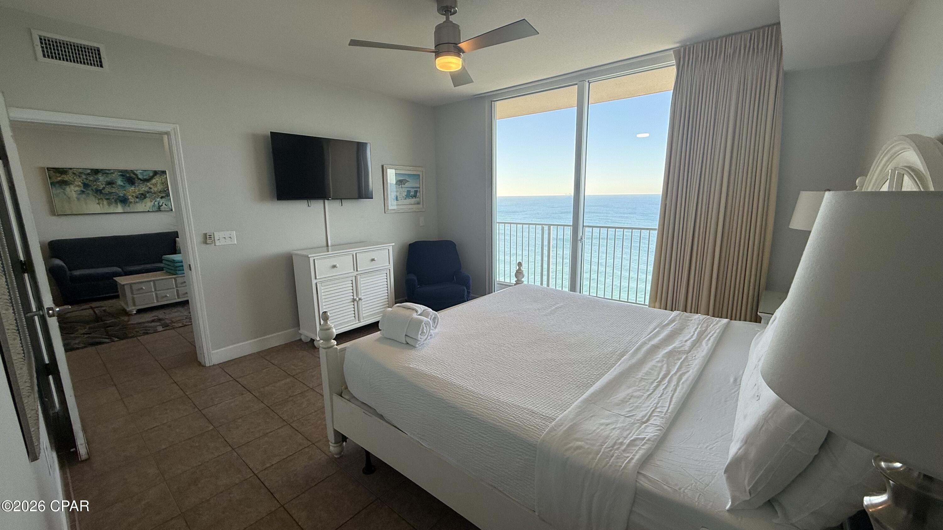 Move-in or rental-ready Gulf-front condo at Tidewater Beach Resort! Unit 2315 is a beautifully decorated 1BR + bunk area / 2BA offering 923 SF of comfortable coastal living. Enjoy stunning Gulf views from both the living area and primary bedroom through floor-to-ceiling sliding glass doors with custom draperies. Features include tile flooring throughout, an open kitchen with granite countertops and full appliances, and a well-designed layout near the east end of the building. Offered fully furnished, this unit is an excellent rental investment or beach getaway in one of PCB's premier beachfront resorts. Easy access and ready to enjoy!