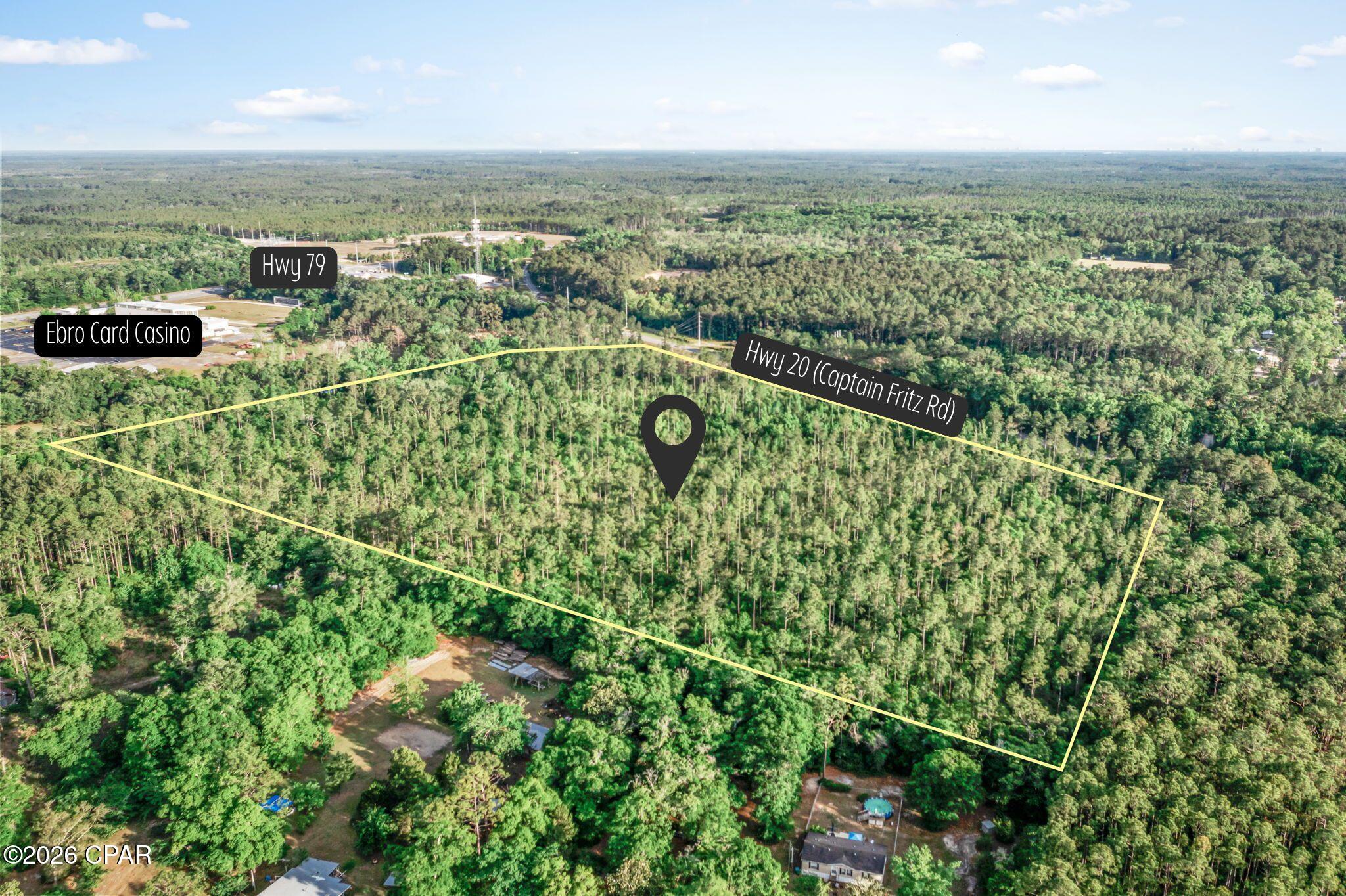 Opportunities like this don't come around often. Ideally located on Hwy 20 (Captain Fritz Road) and adjoining the Ebro Card Casino and Racebook, this 32.5+/- acre parcel offers a prime blend of visibility, accessibility, and future potential. With over 1250ft of Hwy frontage and proximity to a high-traffic corridor, this property also presents a strong opportunity for future development. Buyers may explore the possibility of rezoning to commercial, making it an excellent candidate for a business venture in a steadily growing area. The land is primarily wooded, giving you the flexibility to clear and design the property to fit your vision while still enjoying a private, natural setting. Conveniently located just a short drive to Panama City Beach, shopping, and dining, this property offers both seclusion and accessibility. Whether you're looking to build now or invest for the future, this versatile tract provides the space and potential to make it your own.