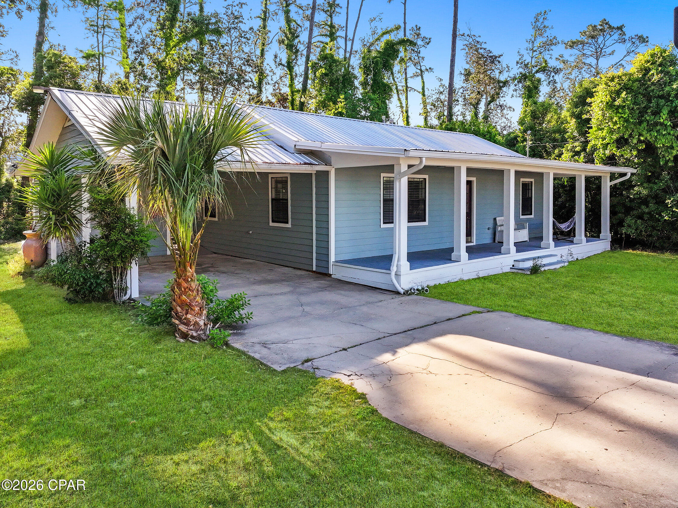 CURRENTLY UNDER CONTRACT, SELLER WILL CONSIDER BACKUP OFFERS - - - - - - Newly remodeled and move-in ready, this charming home situated on two parcels totaling approximately .65 acres, including the additional lot 03060-020R, this property provides extra privacy, room to expand, and endless possibilities.  From the moment you arrive, you'll love the inviting curb appeal featuring a spacious covered front porch--perfect for relaxing with your morning coffee. Inside, the home features bright open living spaces, and plenty of natural light. The remodeled kitchen offers abundant white cabinetry, stainless steel appliances, ample counter space, and a seamless flow into the living and dining areas--ideal for both everyday living and entertaining.  The home also features generously sized bedrooms, updated bathrooms, and a functional layout with plenty of storage. An oversized covered back patio adds even more room to enjoy outdoor living, host guests, or unwind while overlooking the expansive yard.  With no HOA, you'll enjoy added flexibility and freedom.  Located just minutes from Port St. Joe's beautiful beaches, boat ramps, schools, shopping, and downtown dining, this newly remodeled property is an excellent opportunity for a primary residence, vacation getaway, or investment property with additional land included.