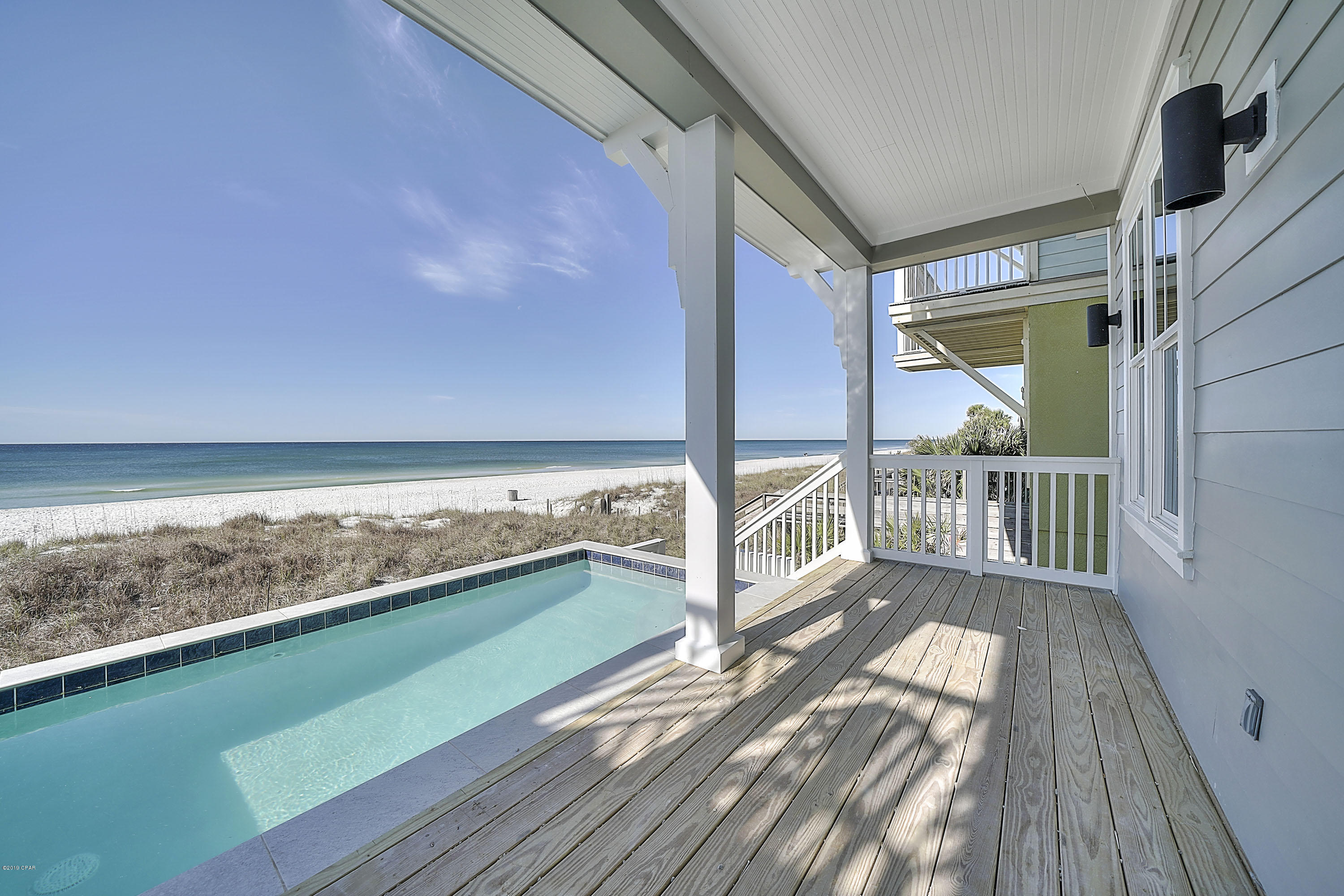 Price REDUCED!!! Buy now before Summer rental season! CONSTRUCTION NOW COMPLETE!! GULF Front 3-story home in Laguna Beach with POOL, ELEVATOR and attached garage. This home features 5 bedrooms and 5 1/2 baths, 2832 sq ft total with balconies off the 2nd and 3rd floor and covered porch on 1st floor leading out to the gulf front pool. With porcelain tile flooring throughout the home, recessed lighting, crown molding, custom closet shelving, solid core interior doors, quartz countertops, Rinnai tank-less water heater with recirculating loop and porcelain tile showers & tub surrounds - this home is absolutely gorgeous ***Amazing gulf front home - West Panama City Beach and under $2M! Contact your Realtor today to come take a lo