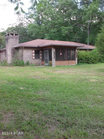 This old home place is in need of some TLC but is a beautiful setting for someone who wants to live the country life. Sit and relax on the covered fishing dock that overlooks the pond in the backyard. The three bedroom/3or bathroom house is just waiting for someone with the right touch to come along and get it to it's prime potential. Seller is very motivated so don't wait too late to schedule an appointment to view this property.