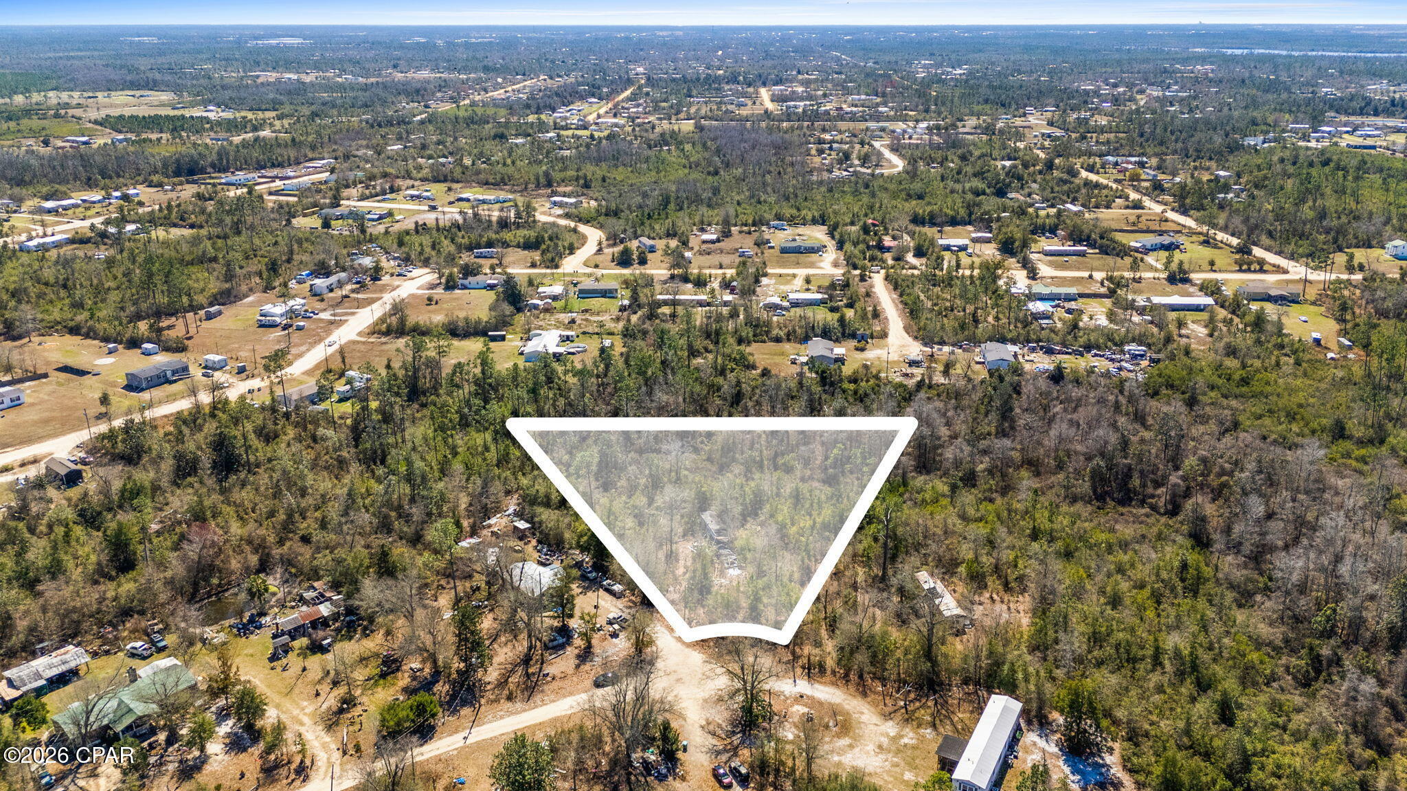 If you've been searching for a private homesite with room to create your vision, this parcel on Oakridge Ln in Youngstown offers a great opportunity. Featuring natural tree coverage and surrounded by rural homesites, the property provides a quiet setting with flexibility to build your future residence, place a manufactured home (buyer to verify), or hold as an investment.

Located in the growing Youngstown area, the property offers convenient access to Hwy 231 and an easy drive to Panama City, shopping, dining, and everyday amenities while maintaining the privacy and relaxed pace of country living. The surrounding area is known for spacious lots, wooded landscapes, and the freedom that continues to attract buyers seeking affordability and flexibility.

Buyer to perform all due diligence regarding utilities, zoning, land use, access, environmental conditions, and property suitability for intended use.