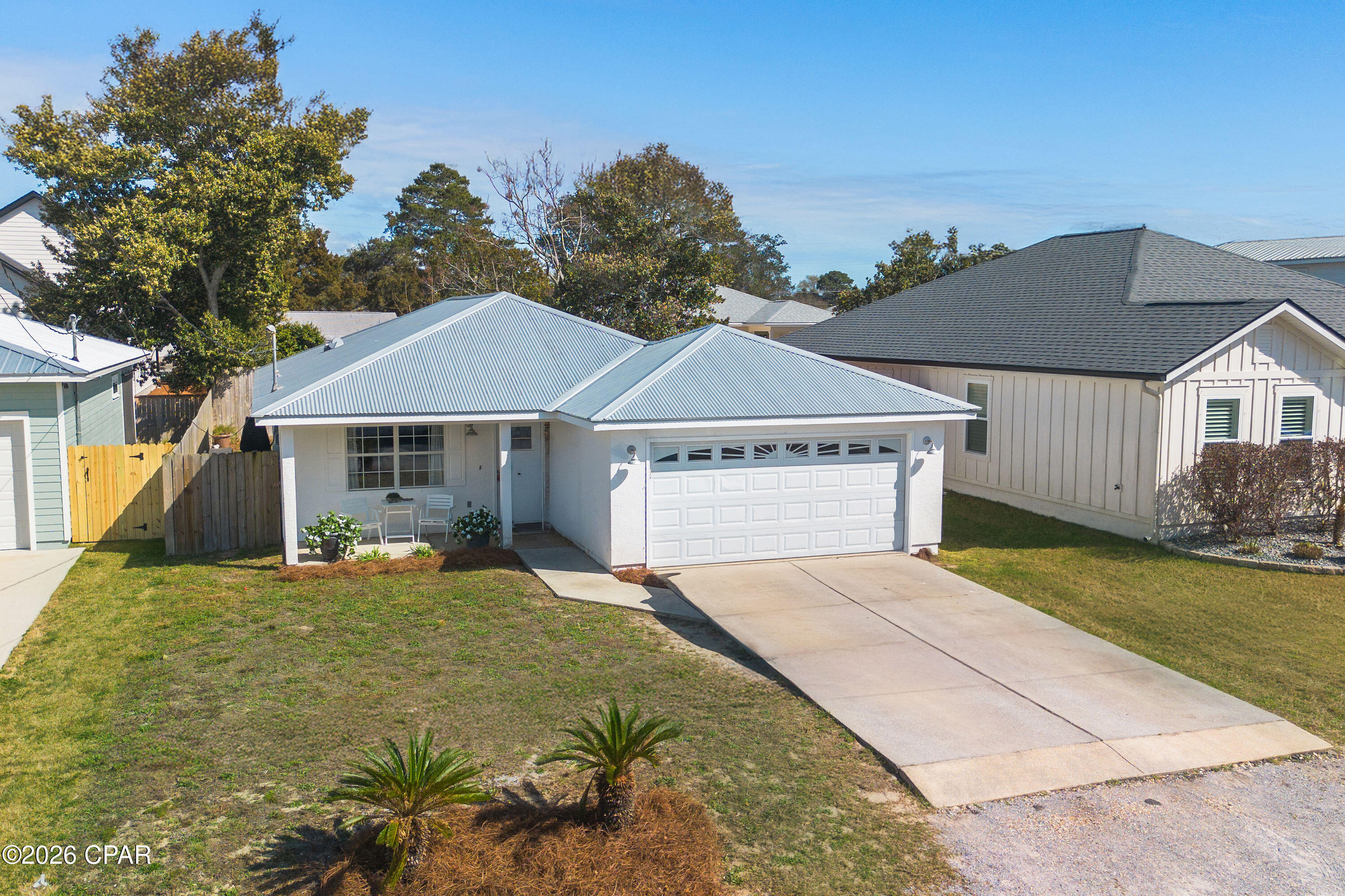 Welcome to this beautifully updated 3BR/2BA home located on the desirable West End of Panama City Beach. With no HOA and short term rentals are allowed, this property offers excellent flexibility as a primary residence, second home, or investment opportunity.

Less than a 10 minute walk to the sugar white sands and emerald waters of the Gulf of Mexico, this home combines coastal convenience with everyday comfort. Ideally situated just minutes from Pier Park, 30A dining and shopping, and Lake Powell the largest coastal dune lake in North America with nearby public boat access. Walk to Publix, CVS, and Lake Powell Park.

Extensively remodeled in 2020, updates include a new roof, HVAC system, hot water heater, cabinets, countertops, appliances, and flooring. The open concept layout features a bright kitchen with island seating, stainless appliances, and updated finishes throughout. The private fenced backyard offers space to relax, entertain, or customize to your needs.

Move-in ready and ideally located, this West End property delivers coastal living with strong rental potential and no HOA restrictions.