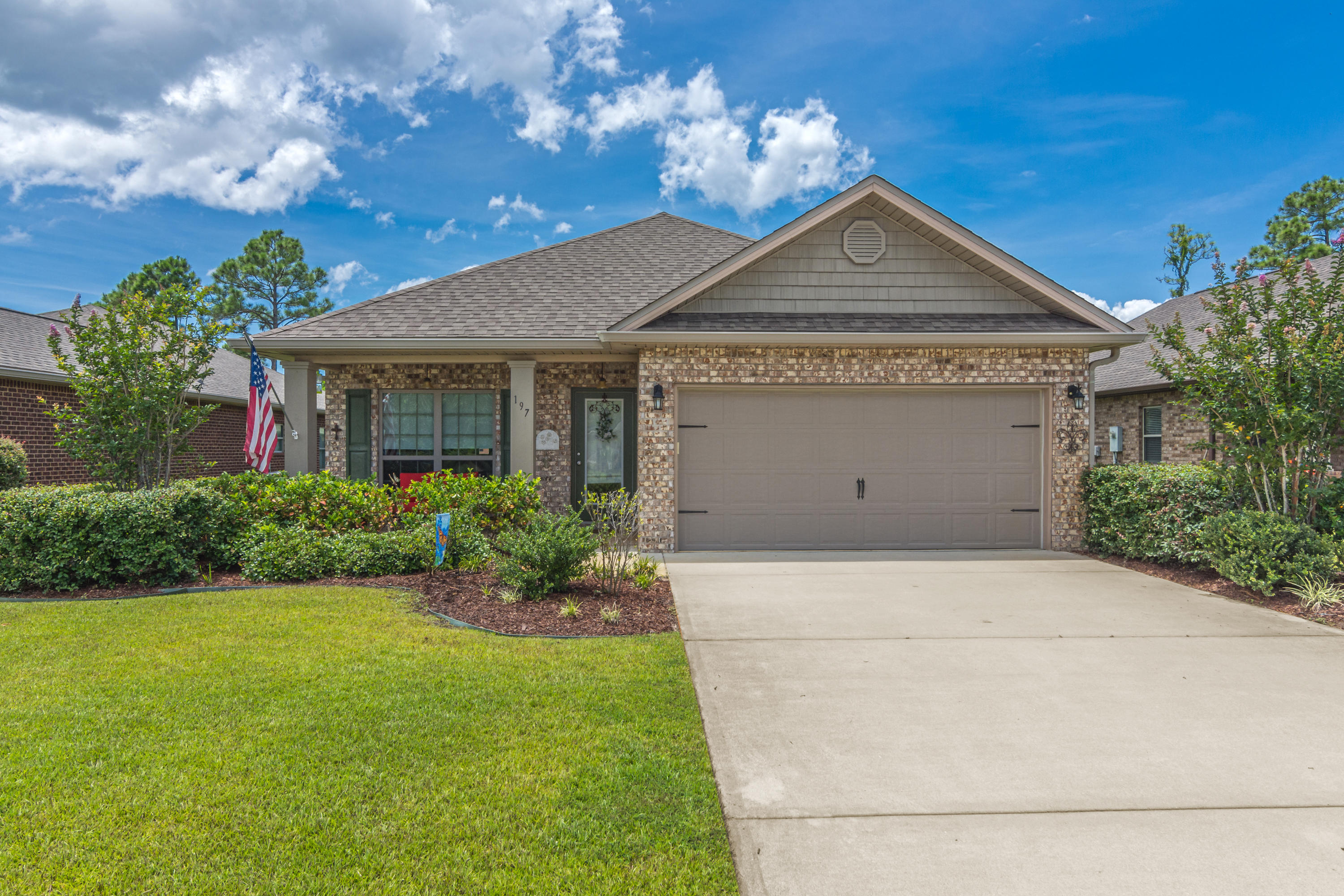 3BR + Office / Second Den!  Upgrades include fenced yard, office with french doors, granite counters, jet tub & tile shower in master, irrigation and pump, front gutter, backyard screened porch & pergola, and garage improvements.  Just 10 minutes from the 30A beaches, this coastal-craftsman style home is finished in contemporary brick.  Directly across the street from the pool and clubhouse, with easy walk or bike access to the Walton County park (tennis, basketball, soccer).  Open floor plan, with kitchen and dining flowing together, into the living room which is roomy and features a vaulted ceiling.   Master bedroom features tray ceiling, dual vanities, separate tub and water closet, and walk-in closet.  Direct access to dining, recreation, shopping, and Sacred Heart Medical services.