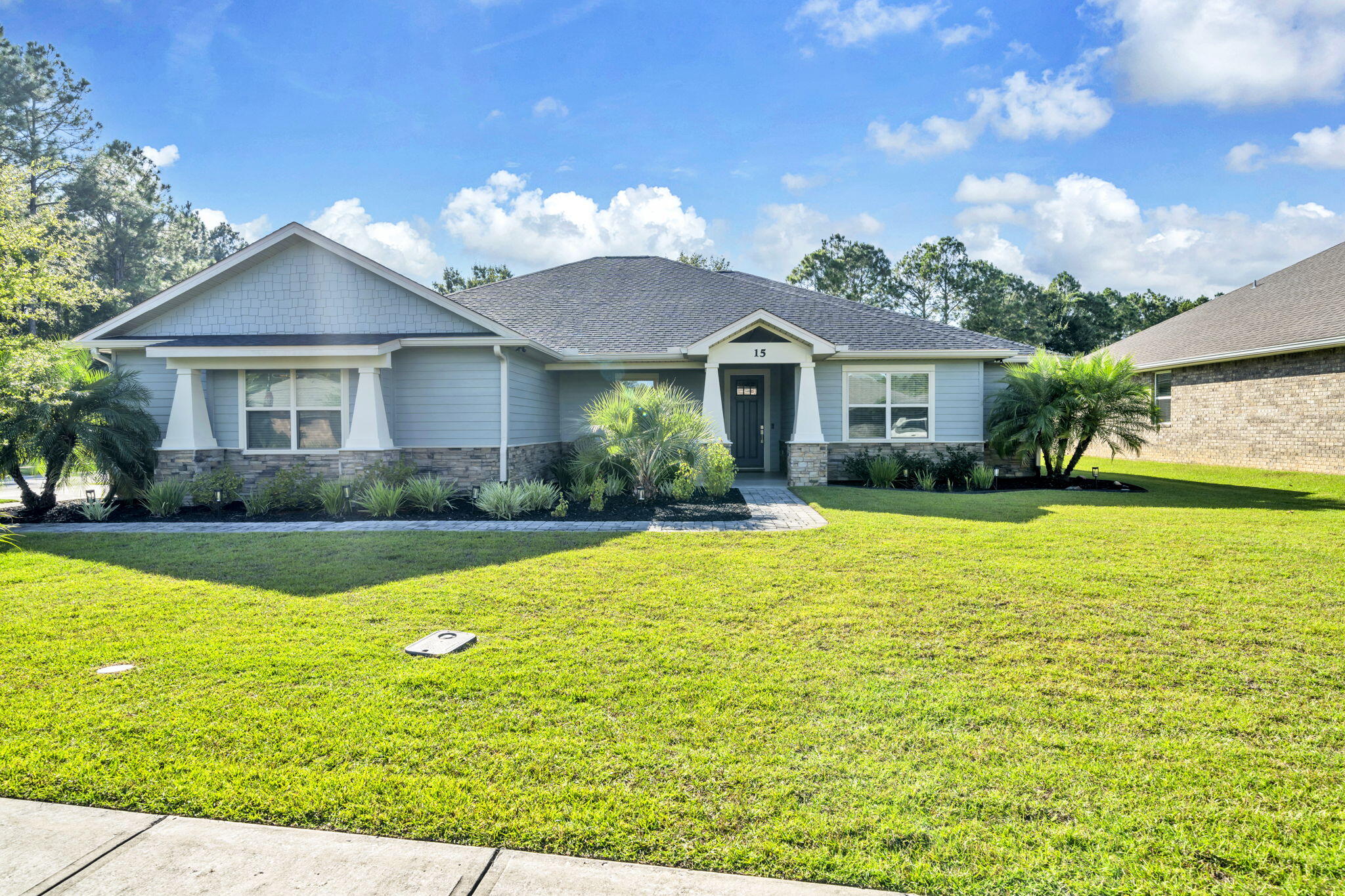 BIG price improvement! The sellers just reduced this custom Craftsman-style home by $24,000 and are ready to make a move. If you've been waiting for the right home in Hammock Bay, this one hits differently. It blends lifestyle, comfort, and thoughtful design in a way you can feel the minute you step inside. You're welcomed by a spacious open-concept layout with durable luxury vinyl plank flooring and a custom built-in bar complete with a wine cooler—perfect for gatherings, game days, or simply winding down. The kitchen is designed for everyday cooking and holiday hosting with quartz countertops, stainless steel appliances, custom cabinetry, and a gas stove that makes meal prep feel downright fun. The primary suite is tucked away for privacy and offers a spa-inspired experience: dual vanities, a dedicated makeup area, a dual-head shower, a walk-in closet, and even a bidet in the water closet. With five roomy bedrooms, you have space for guests, hobbies, workouts, or the home office you've been dreaming about.
Step outside and enjoy Florida living year-round. Sip morning coffee on the charming front porch, catch the big game on the mounted TV from the screened-in back porch (it conveys), or grill out on the extended paver patio. There's room to relax, recharge, and reconnect.
Behind the scenes are the upgrades you don't always seebut you'll absolutely appreciate: a Rinnai tankless water heater for endless hot water and a whole-house generator for peace of mind during storm season.
This home has been loved, cared for, and customized with intention. Now it's ready for its next chapter. If you've been searching for a beautiful home in Hammock Bay that offers quality, comfort, and lifestyleall wrapped into onethis might be the one that finally feels right.
Reach out to schedule a showing and come experience what makes this place so special.