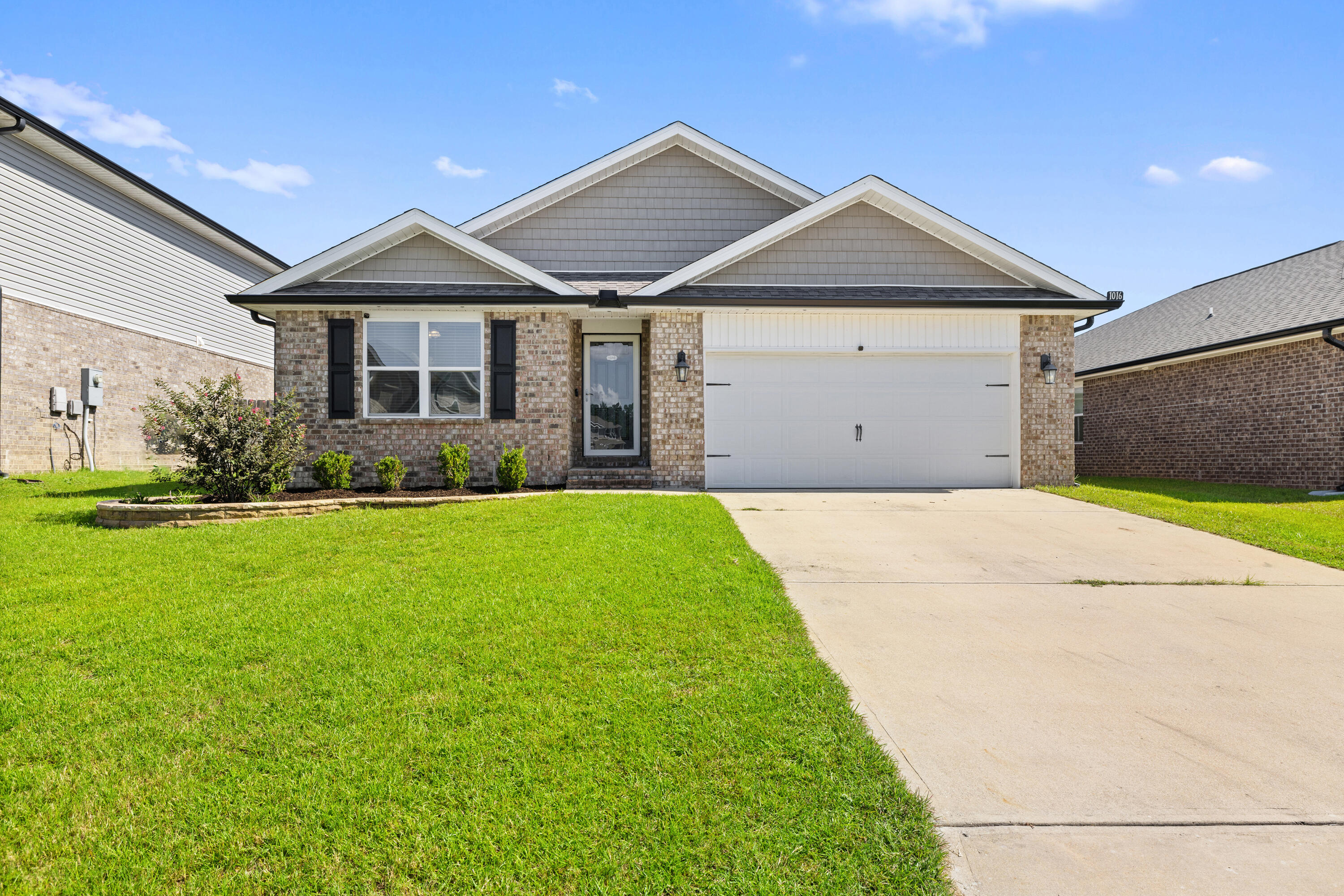 Welcome to this tastefully designed contemporary home in the desirable Redstone Commons neighborhood. This single-story residence showcases the owner's attention to detail the moment you step inside. The spacious open floor plan creates a natural flow between the kitchen, dining, and living areas, making it ideal for both everyday living and entertaining.
The kitchen is a true centerpiece, featuring a central island with bar seating, granite countertops, soft-close cabinetry, a touch-activated faucet, and sleek stainless steel appliances. The private main suite sits at the back of the home, offering a peaceful retreat with a walk-in closet, double vanity sinks, and an oversized 5-foot shower.