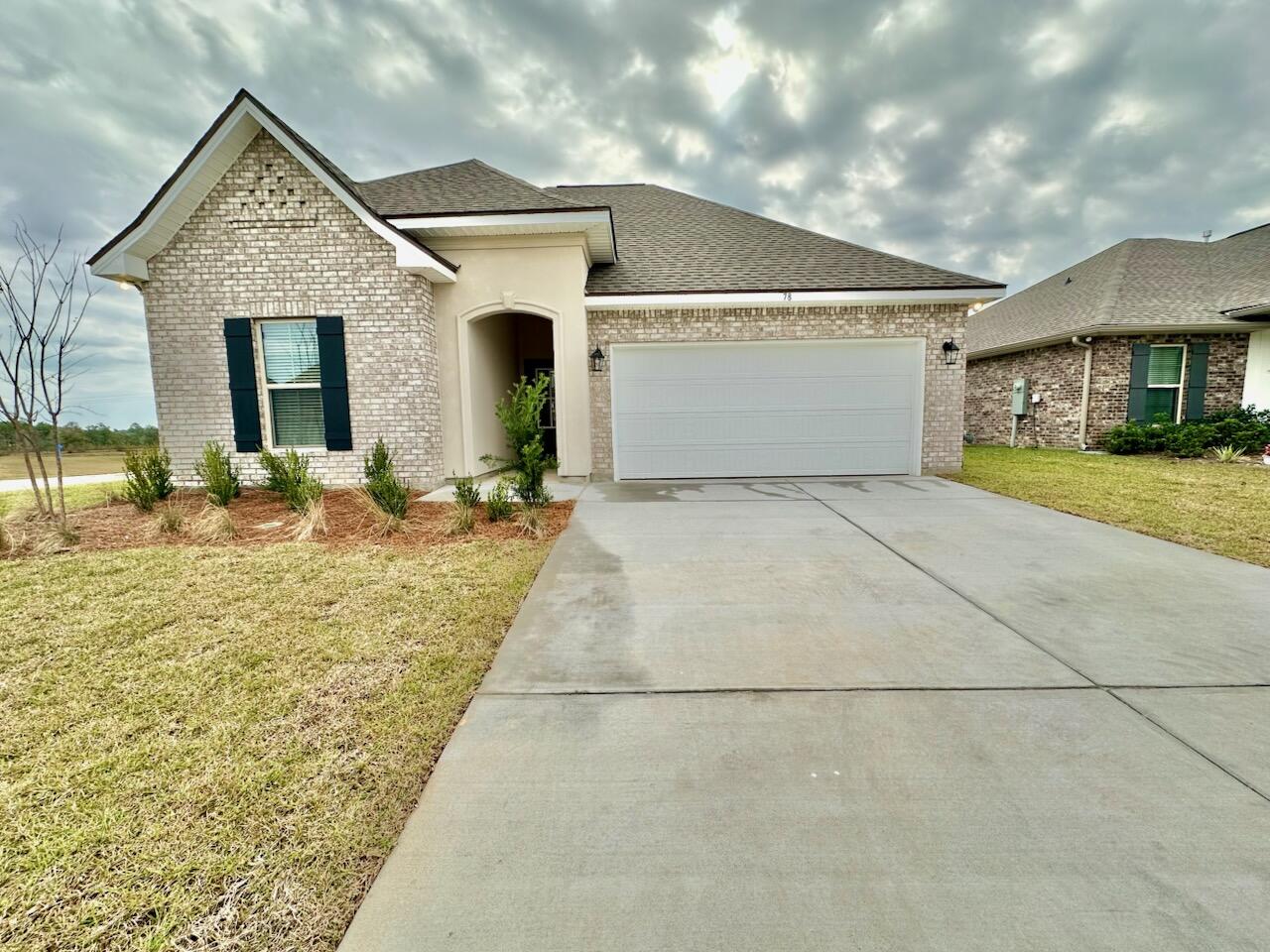 Welcome to this beautifully designed 3BR/2BA single-story home in The Bluffs at Lafayette. Built in 2025, it offers 1,848 sq ft with a split floor plan and thoughtful upgrades. The spacious primary suite includes a double vanity, soaking tub, tiled shower, and walk-in closet. The kitchen features a large island, breakfast bar, pantry, and recessed lighting, opening to a bright living area ideal for entertaining. Additional features include crown molding, tile flooring, double-pane windows, a laundry room, covered patio, front porch, and attached garage. Located on a corner lot with sidewalks and convenient access to 30A beaches, Eglin AFB, and Hurlburt Field. Call 850-716-1712 to schedule a showing.