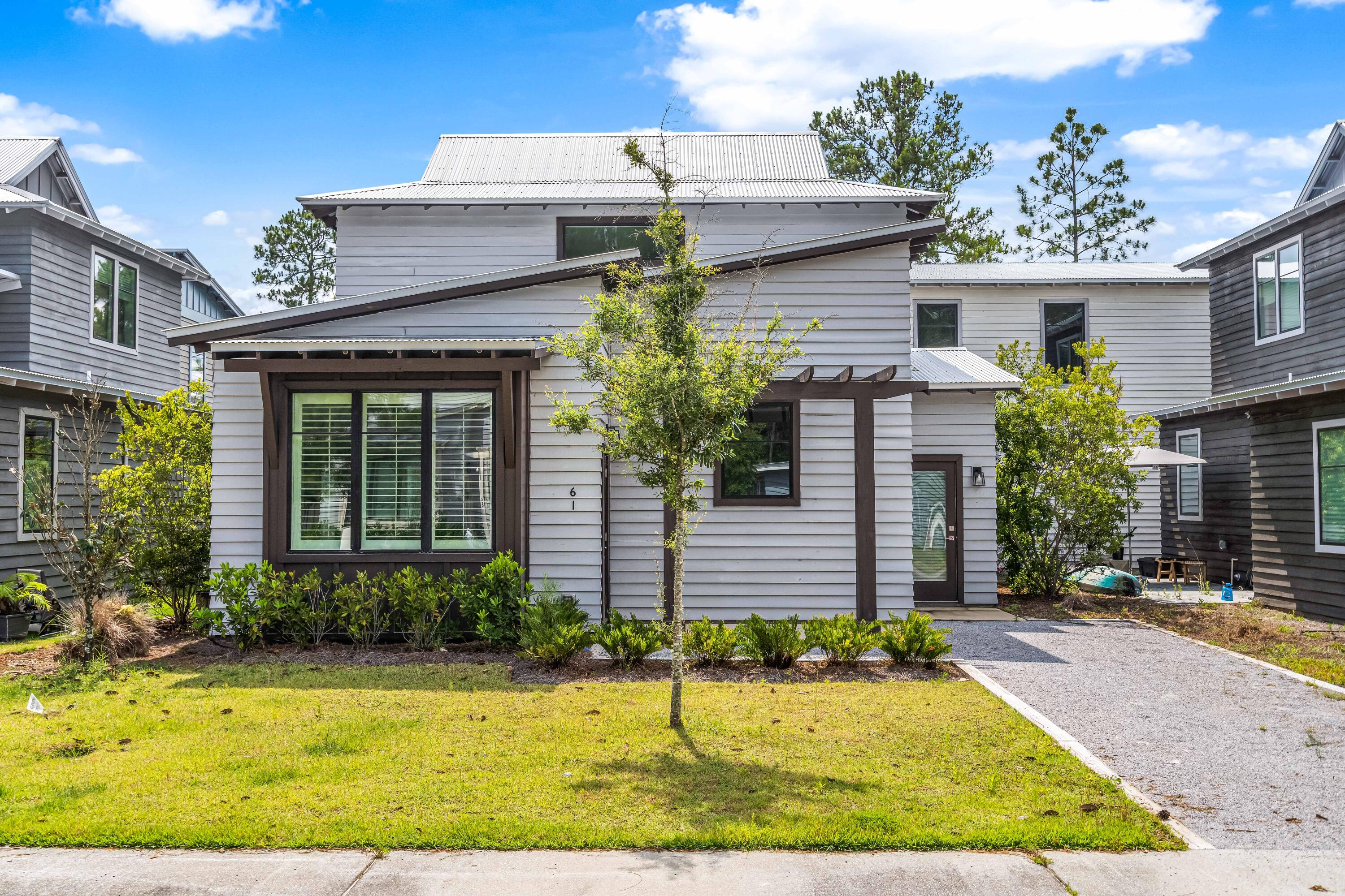 Welcome to 61 Eden's Landing, a charming coastal cottage located in the peaceful and highly sought-after Point Washington community of Eden's Landing. This beautifully maintained 3-bedroom home features a thoughtful layout with the primary bedroom and en-suite bath conveniently located on the first level, offering privacy and comfort for full-time living or a second-home retreat.

The open-concept main living area is filled with natural light and flows seamlessly into a well-appointed kitchen, creating an ideal space for relaxing or entertaining. Upstairs, two generously sized guest bedrooms and a shared bath provide perfect accommodations for family or visitors. Enjoy the quiet surroundings of Point Washington while being just minutes from Eden Gardens State Park, the bay, and the sh