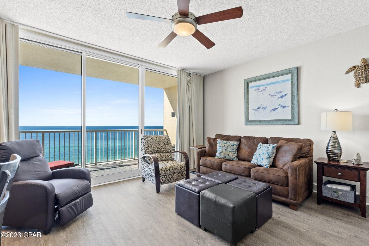 The beach getaway you have always dreamed of - a beach inspired 2/2 Gulf front condo at Majestic Beach Towers. Whether you are ready to live on the beach or invest in a rental property, this is the perfect condo for you! Gorgeous Riveting Gulf views are framed by beachy chic interiors, designed with the Gulf of Mexico and sun in mind. Sunshine and warm gulf breezes abound from the generous balcony, with amazing water and beach views. This fresh, ultra clean, meticulously maintained, turnkey offering has all of the extras and will convey fully furnished, decorated, and rental ready. New Luxury Vinyl Plank flooring throughout and wainscotting in common areas makes for super low maintenance. Recent appointments include aforementioned new flooring, new polywood balcony furniture, new front door lock that can be controlled remotely, new front door, and smart thermostat. HVAC replaced '18 and new HWH replaced '20.. New refrigerator installed this year in the gourmet kitchen which features loads of cabinet space and is fully stocked and rental ready. The rest of the condo, including both bedrooms lives larger than its square footage and is spacious and bright. EXCELLENT RENTAL INCOME POTENTIAL - '23 YTD gross rental income of over $58k and Option to keep Snowbird in place from Jan2nd-Feb29th - details available upon request.Fantastic rental history and CTO listed in documents section of the MLS listing. Enjoy the good life at Majestic Beach with an unparalleled deck of resort style amenities including: 650 linear feet of sugar white GULF FRONTAGE, Four Large outdoor pools (2 at Tower I and 2 at Tower II), Two Indoor heated pools (one in Tower I and one in Tower II), Two hot tubs, Baby pool, Wading pool with waterfall, H20 Bar and Grill serving Gulfside/Poolside lunch and dinner, Large outdoor dining area, State of the Art Fitness center, 130 seat Stadium seating Movie Theatre, Convention center, Private Owner's Lounge with full Kitchen, Tennis Courts, Majestic Market featuring Starbucks coffee. Quick distance to the wonderful shopping, dining and entertainment at Pier Park. FROM THIS CONDO, YOU ARE WITHIN STEPS OF EVERYTHING YOU COULD EVER WANT AT THE BEACH!