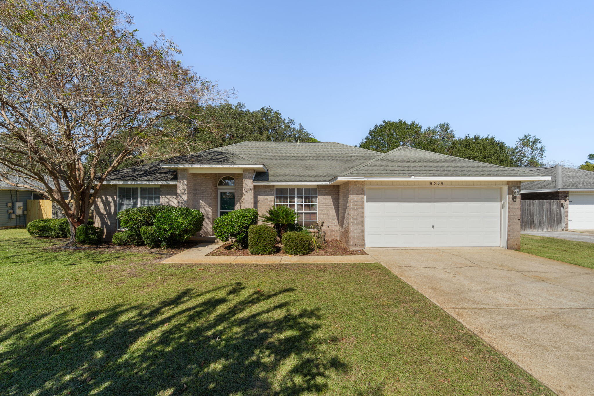 Located in East Navarre, this 3 bedroom, 2 bathroom home offers a solid foundation in an established neighborhood. It features wood-look tile flooring throughout the living areas and bedrooms for easy maintenance and a cohesive feel. The layout provides comfortable living space ready for your personal updates. Out back, you'll find a spacious fenced yard with a storage shed as well. Conveniently situated near Navarre High School, the Navarre Youth Sports Association, playground, YMCA, shopping, and Navarre's beautiful beaches! New roof November 2025.
