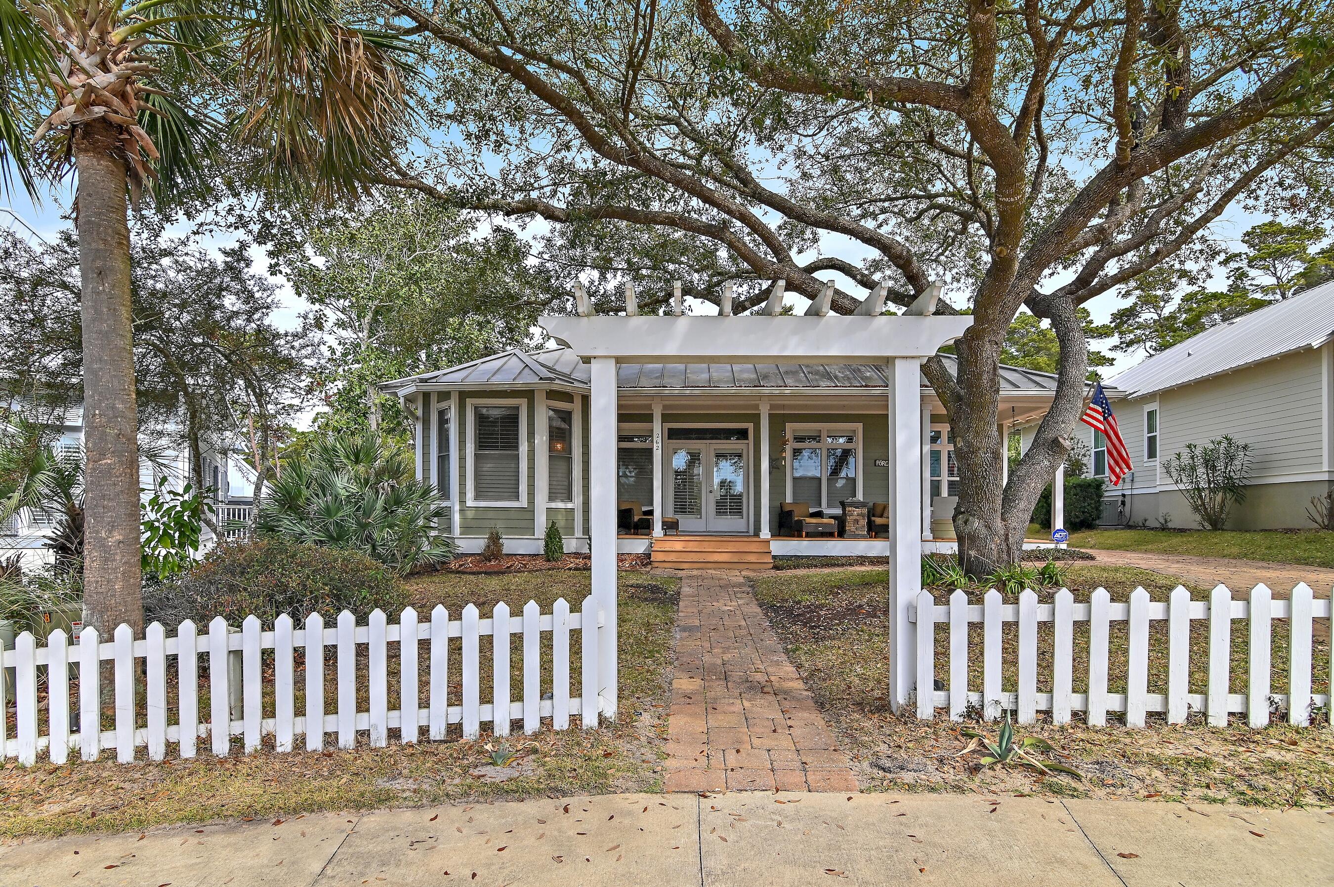 Welcome to your dream beach retreat off  of 30A! Nestled in a serene and peaceful neighborhood, this charming beach cottage is the perfect oasis for those seeking a primary or second home near the beach. Situated just a short stroll away from beach access, this property offers the best of coastal living.  This home comes with a coveted carriage house above a two-car garage for guests or for use as supplemental income. The home backs up to Florida Forestry making for a peaceful and serene back drop.  Only 2,700 feet from home you will be relaxing on the sugar-white sand & clear Emerald Coast waters of one of Florida's Top-Rated Beaches. This fantastic beach home is within a short walking distance or golf cart ride to 1 neighborhood beach access & 2 public beach accesses. Located on the West end of the Scenic 30A corridor, this location is undeniably the most convenient to South Walton County's premier shopping, restaurant districts & amenities, such as Grand Boulevard, Sacred Heart Hospital, Van R Butler Elementary School and a phenomenal state park known as Topsail State Park, which offers guests 1,600 acres of indigenous forest, 3-miles of native, protected beach, and hiking & biking trails.  NEW ROOF AND GUTTERTS STARTING NEXT WEEK!

Sea Dunes exemplifies the quintessential beach vibe that earmarks 30A. Sea Dunes offers low HOA fees with no short-term rentals, 90 day minimum. Please inquire for further details and to schedule a private showing.

Notable features:  New hot tub, ample parking, electronic dog fence, reverse osmosis water system, carriage house, alarm, Jenn-Air refrigerator, new appliances and golf cart!