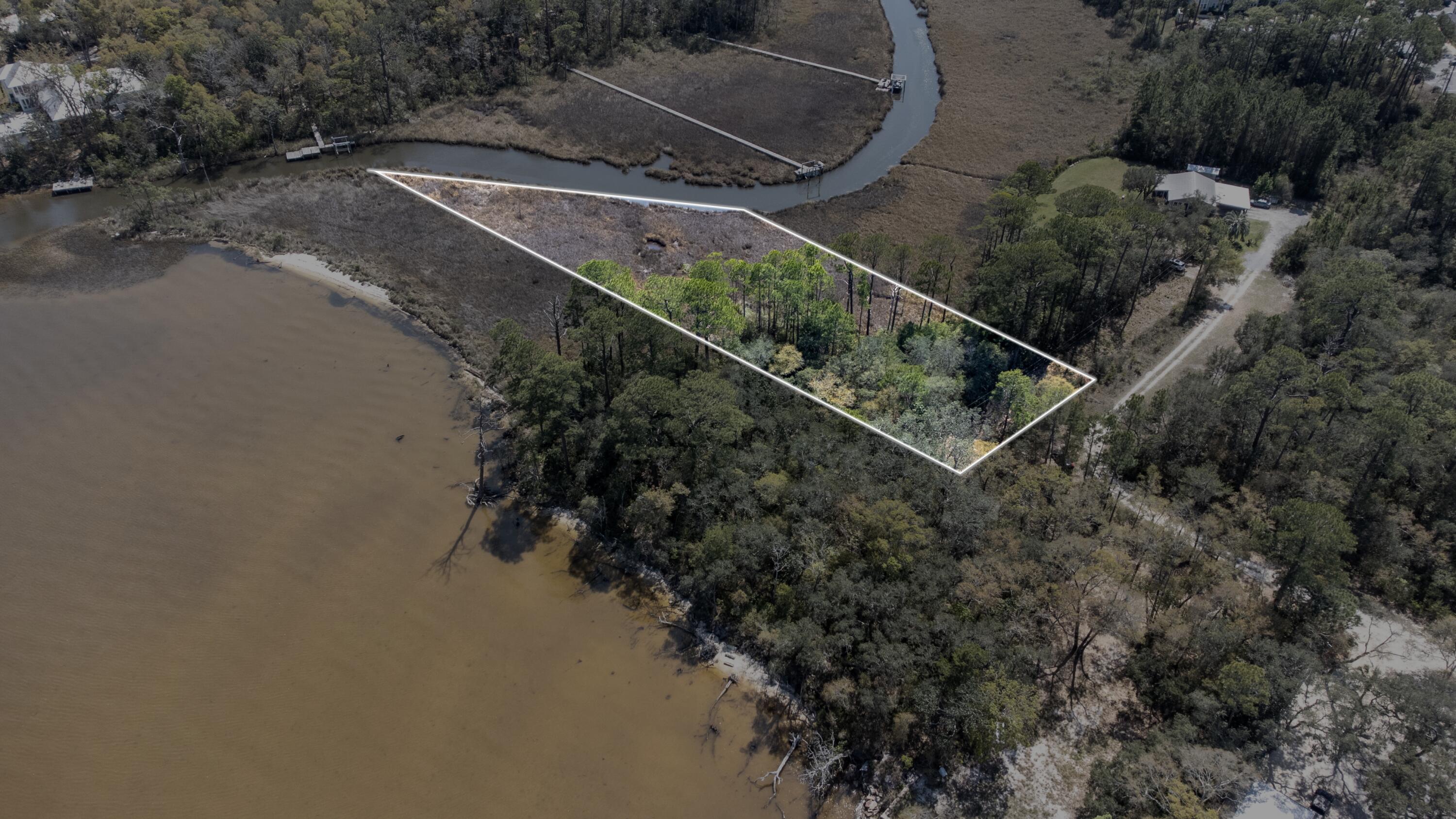1 of 4 Lots available. Discover a rare opportunity to own a bayou-front homesite in the peaceful Santa Rosa Beach, located in the Rosestar Subdivision off Bay Magnolia Lane. This waterfront lot offers approximately 1.23 acres with boat slips allowed, making it ideal for boating, kayaking, fishing, and enjoying the coastal lifestyle right from your property. Located on a private road with no HOA, the property provides flexibility to design and build with fewer restrictions. CYou may build on the wetlands up to 40%, allowing flexibility for future development while maintaining the natural surroundings. The Development Order is currently being completed and is expected to be finished in early June 2026, making now an excellent time to secure the property before developmen Is finalized. Whether you are looking to build your dream coastal home, a private retreat, or invest in future development, this bayou-front property offers excellent potential in Santa Rosa Beach. Can build up to 1700sqft per floor, 2 story max.