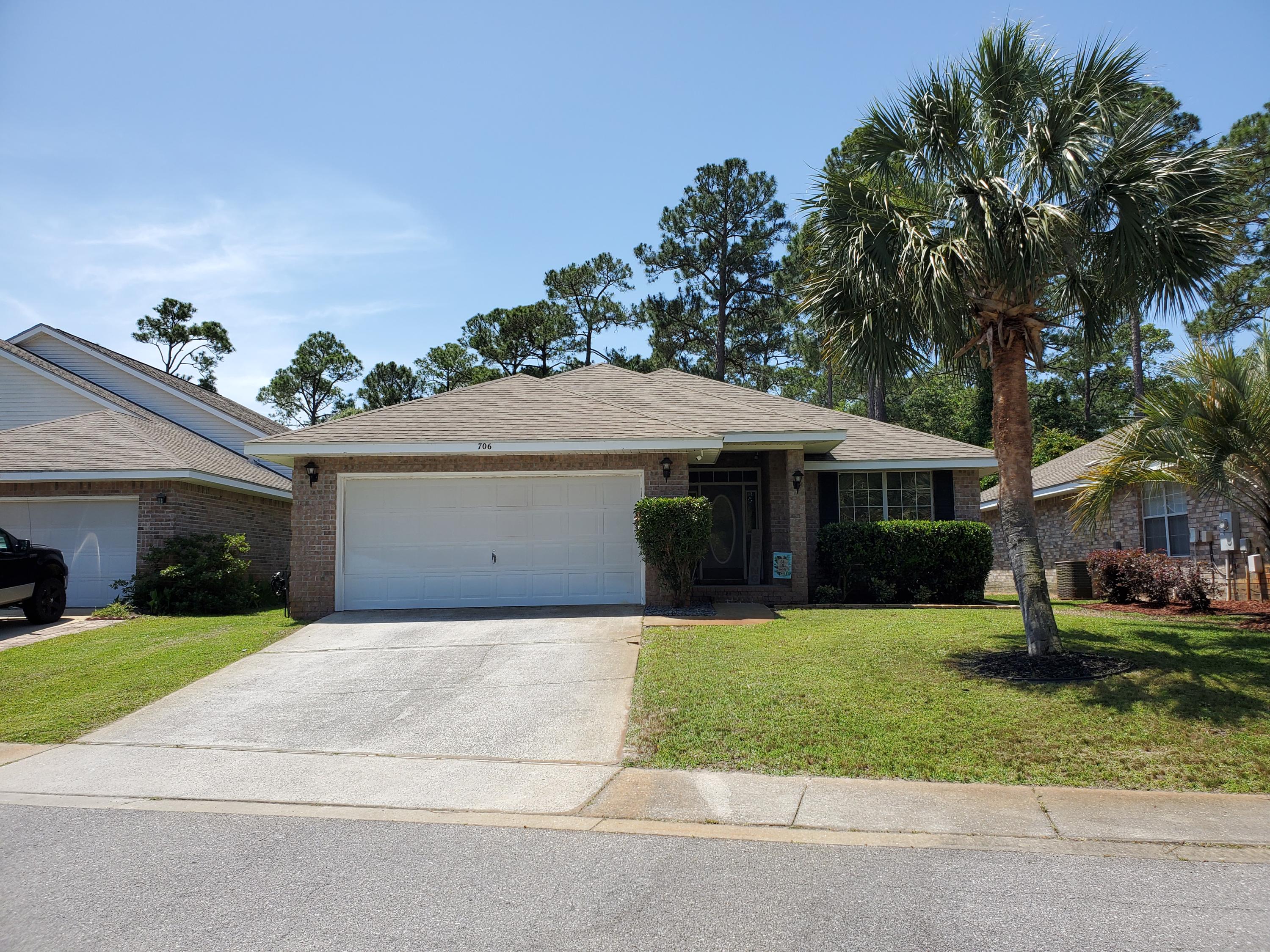 Beautifully updated open floor plan home. Set in the private friendly neighborhood of Marsh Harbor. Tall vaulted ceilings in great room, kitchen and dining area. All new flooring, quartz kitchen countertops, disposal, chalkboard wall, sink/faucet, shiplap bar, and light fixtures. New wood laminate flooring in all living space including front office, new carpet in bedrooms, new toilets and tile in bathrooms. New light fixtures in all rooms. All new interior paint including a black chalkboard wall in the kitchen. New smart thermostat, Arlo security system, and rainbird sprinkler system. Access to boardwalk and dock into the Santa Rosa Sound. Interior laundry room in between kitchen and garage. Front office area with a gorgeous front view of the center retention pond; also has a closet and could double as a fourth bedroom. Inset rear porch. So many things make this home a wonderful place to live