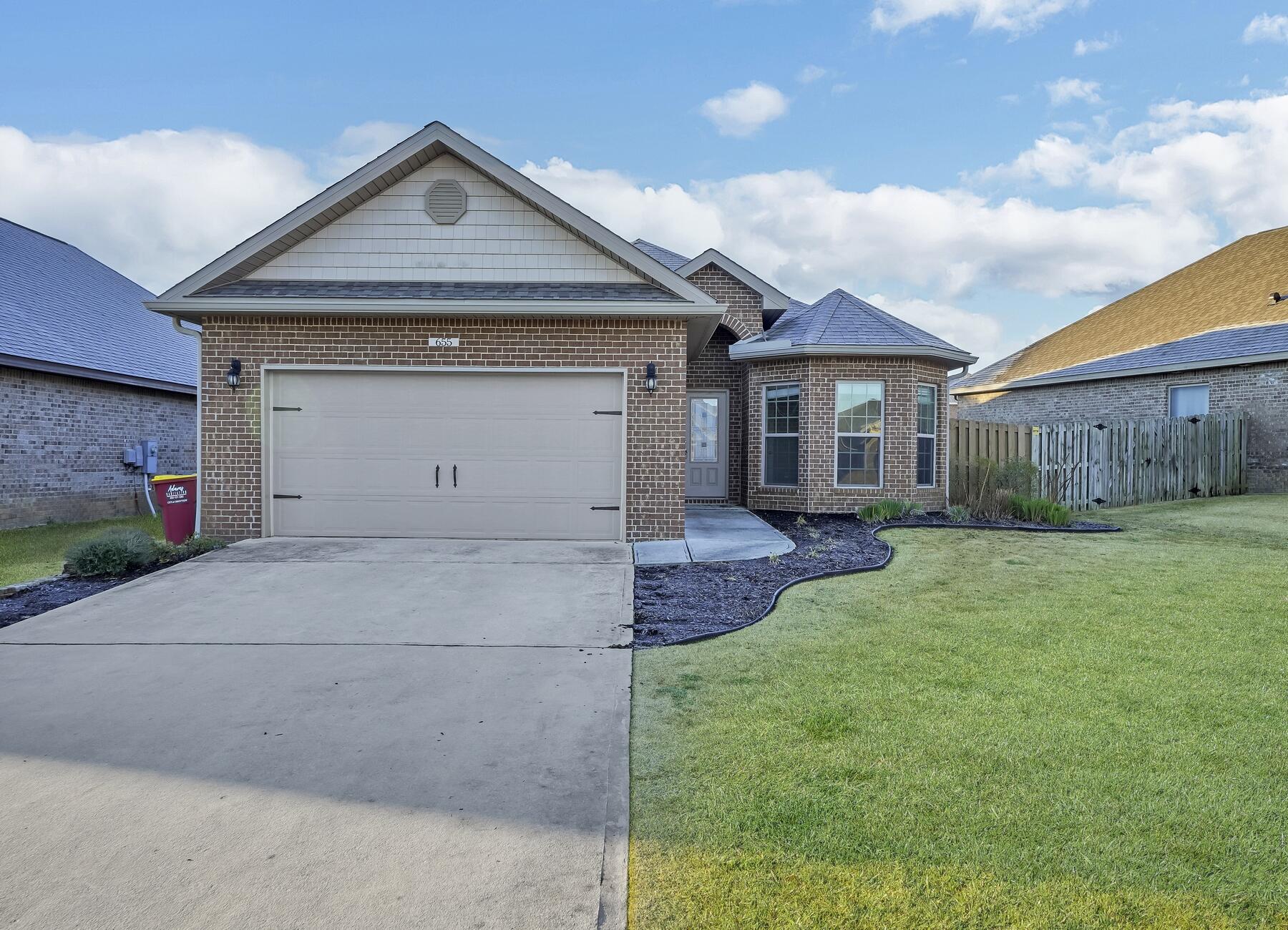 *Assumable VA loan at 2.875% with a balance of $296K. Home sweet home nestled in the beautiful neighborhood of Redstone Commons. Upon entering, you are greeted by an open concept living area, dining area, and kitchen. The kitchen boasts an island with an overhang perfect for barstools, stainless steel appliances, a sleek backsplash, a walk-in pantry, cabinet drawer systems, and adequate storage space. The master suite features tray ceilings and large windows overlooking the backyard. As you move onto the master bathroom, you'll find a double vanity and spacious walk-in closet. The fenced backyard offers privacy, a screened in porch, and a clean landscape. Other notable features of the home include a sprinkler system, gutters, and custom blackout shades for the living room and master suite