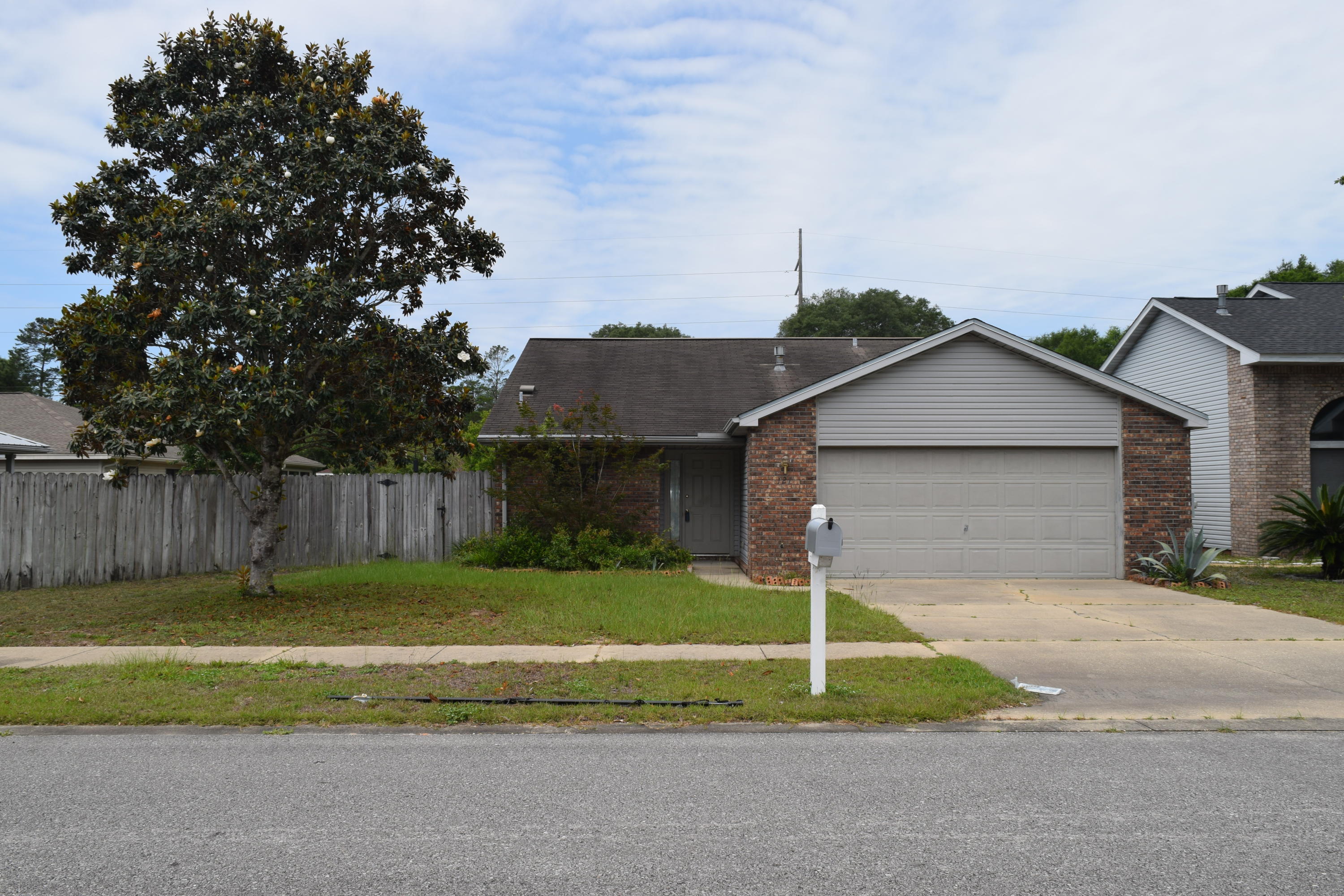 Excellent value! Stretch your dollar on this well cared for, single owner home. This brick and vinyl sided home means low upkeep and BIG value. Built by a local, quality builder Barton Homes, this property will leave you with more personal time and less chore time. The kitchen is fully furnished with all appliances, pickled cabinets, and a separate pantry lined with ventilated shelving. The large living room has vaulted ceilings, double sliding glass door leading to the back porch which is perfect for bug-free, summer evenings. The open patio is sufficient for your BBQ grill, open fire pit, or Adirondack chairs for relaxation and sunbathing. The two-car garage has a hurricane wind rated overhead garage door with a brand new auto-opener. (You know you want to know MORE!) The garage comes equipped with a small wooden work bench, and a few wooden shelves for organizing, the pull-down stairs allow easy access for storage. The washer and dryer are included with the sale of the home. The home is equipped with gas hookup. The home is also within walking distance to Northwest Florida State College. Come take a look at this gem, it won't last long!