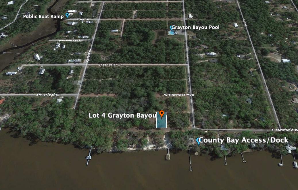 Build your dream home and enjoy the bay views from this Grayton Bayou home site. Grayton Bayou, situated on the bay, features a private community pool for this quaint yet growing neighborhood located less than 5 miles from WaterColor and Seaside. Small neighborhood boat ramp, and Walton County bay access are both located in close proximity. HOA and building restrictions create sense of continuity throughout the neighborhood. Alley easement at back of lot allows garage to be placed at back of home and still have easy access. Underground utilities and streetlights throughout neighborhood create a clean look.