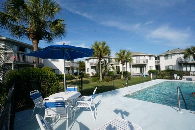 2 Bedroom/2Bath, 2nd Floor Condo & just 3 blocks to the Beach. Crystal Village Community has a Community Pool situated in the center of a large landscaped green space. Community is close to 6 miles of Scenic Gulf Drive with a bike/walking path and Miramar Beach Public Beach Access & Pompano Joe's Beachside Bar & Grill. This 2nd floor unfurnished 2 bedroom Condo has ''hardwood look durable laminate flooring throughout & a large eat in kitchen, with breakfast bar, that is open to the spacious living area. (Stackable washer & dryer in kitchen closet.) Living Room has Sliding glass doors that open to the balcony offering views of the community pool & nicely landscaped green space & Palm Trees. Convenient Parking in front of the Unit. Unfurnished Long Term Rental, No Pets; Non Smokers please.