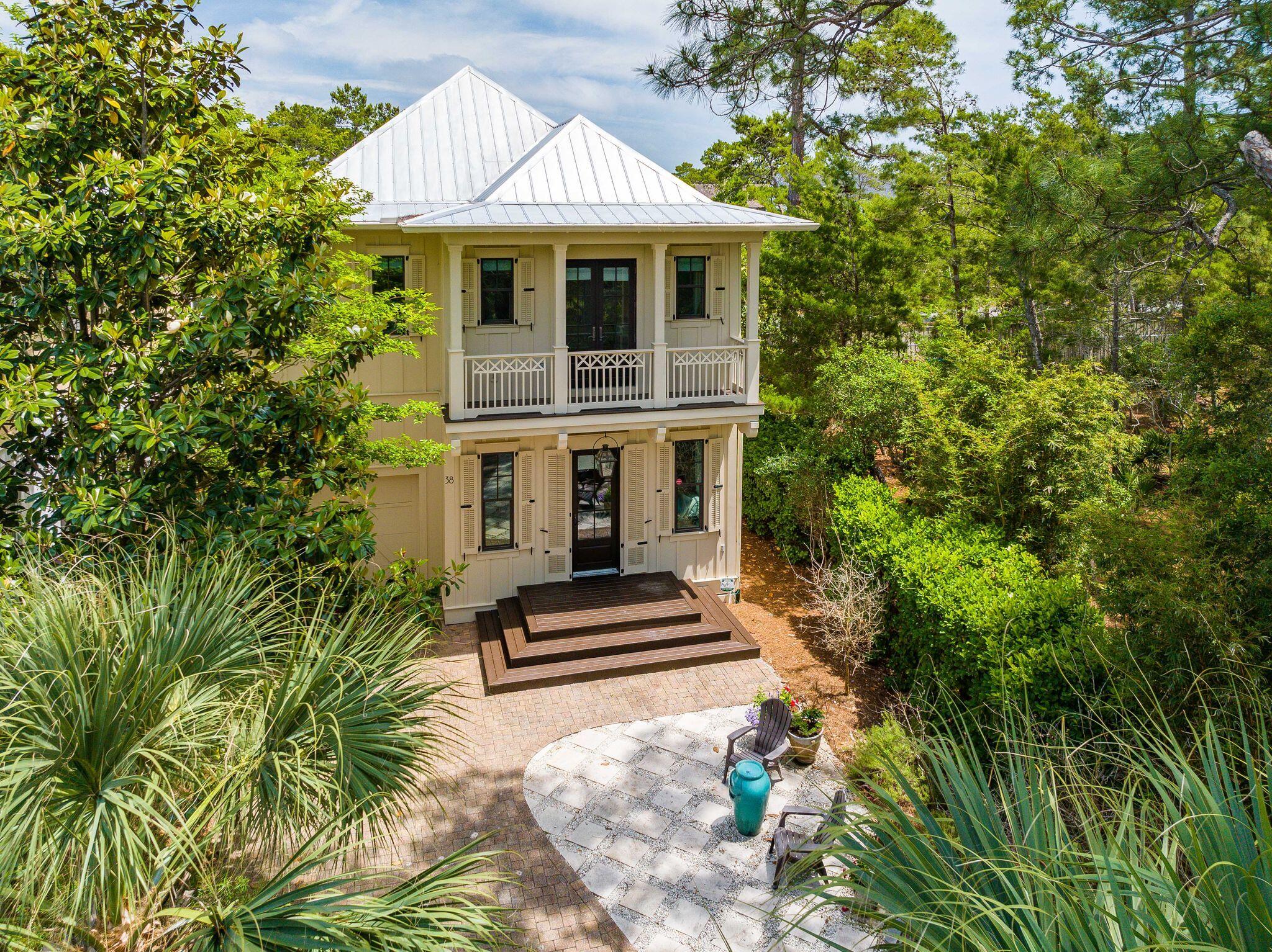 Beautiful Florida cottage offering amazing privacy and high-end finishes located in a prime location close to the beach and nestled between Seaside and Rosemary, this community is charming and peaceful, yet close to all the fun 30A has to offer. Home has NEVER been rented, however it has strong rental potential with projections of $107K and sleeps 13. Features include entire house Kenetico water filtration system, beautiful wire brushed oak hardwood floors, Viking range, hurricane storm doors and windows and new AC units installed less than 2 years ago. The first floor has a spacious living/dining area, beautiful kitchen, bedroom, full bathroom, and screened-in porch. Upstairs there is a laundry room, large master suite, 2 additional bedrooms with ensuite bathrooms and a newly added bunk room that features 5 twin beds. Kitchen features include a walk-in pantry, stainless steel Viking and KitchenAid appliances, marble countertops, tile backsplash, separate ice maker and large farmhouse sink. The master suite has a large walk in closet with built-in shelves, standing shower, two vanities, freestanding soaking tub, access to private balcony. Home is a short walk to the community pool.
