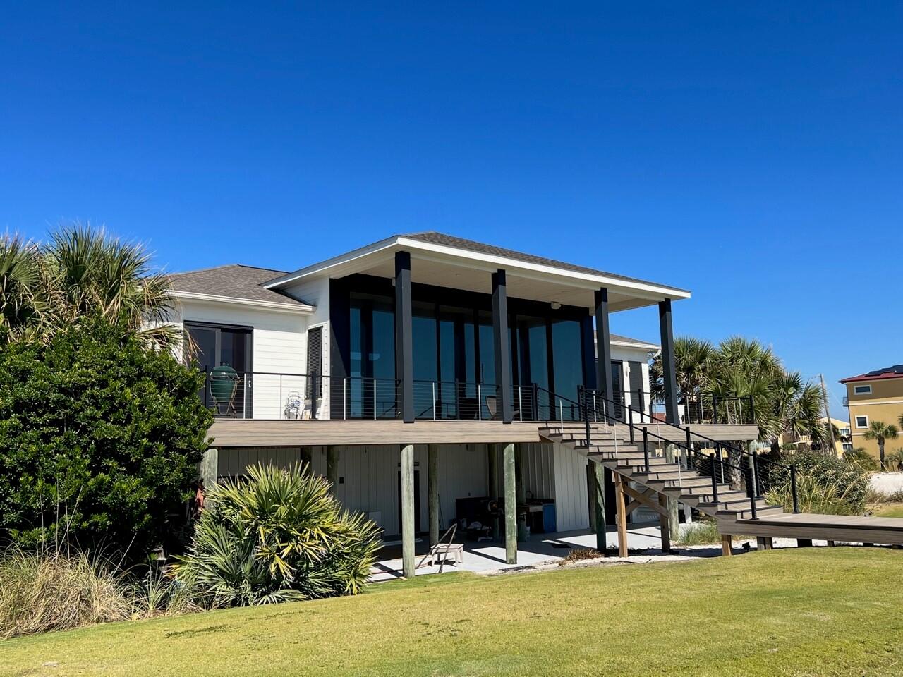 Gulf front! Completely remodeled this year. This stunning home is the ultimate in beach front living. Walk in to find unobstructed and panoramic view of turquoise water and white sand through 40 feet of glass sliders. When all sliders are opened, the opening is approximately 30 feet. The home features an open floor plan with a large living area flowing into the kitchen and the dining area. The fantastic kitchen features 2 Sub Zero refrigerators, a 6 burner Wolf gas stove, other Wolf appliances and a large kitchen island. The primary suite features sliders and access to the Gulf front covered patio. The primary suite includes a luxurious bathroom with two vanities, a generous shower and a fabulous walk in closet. There are 3 other spacious bedrooms each with an en-suite bath.  There is a private boardwalk to the beach, and an oversized garage on the ground level. More pictures to come.