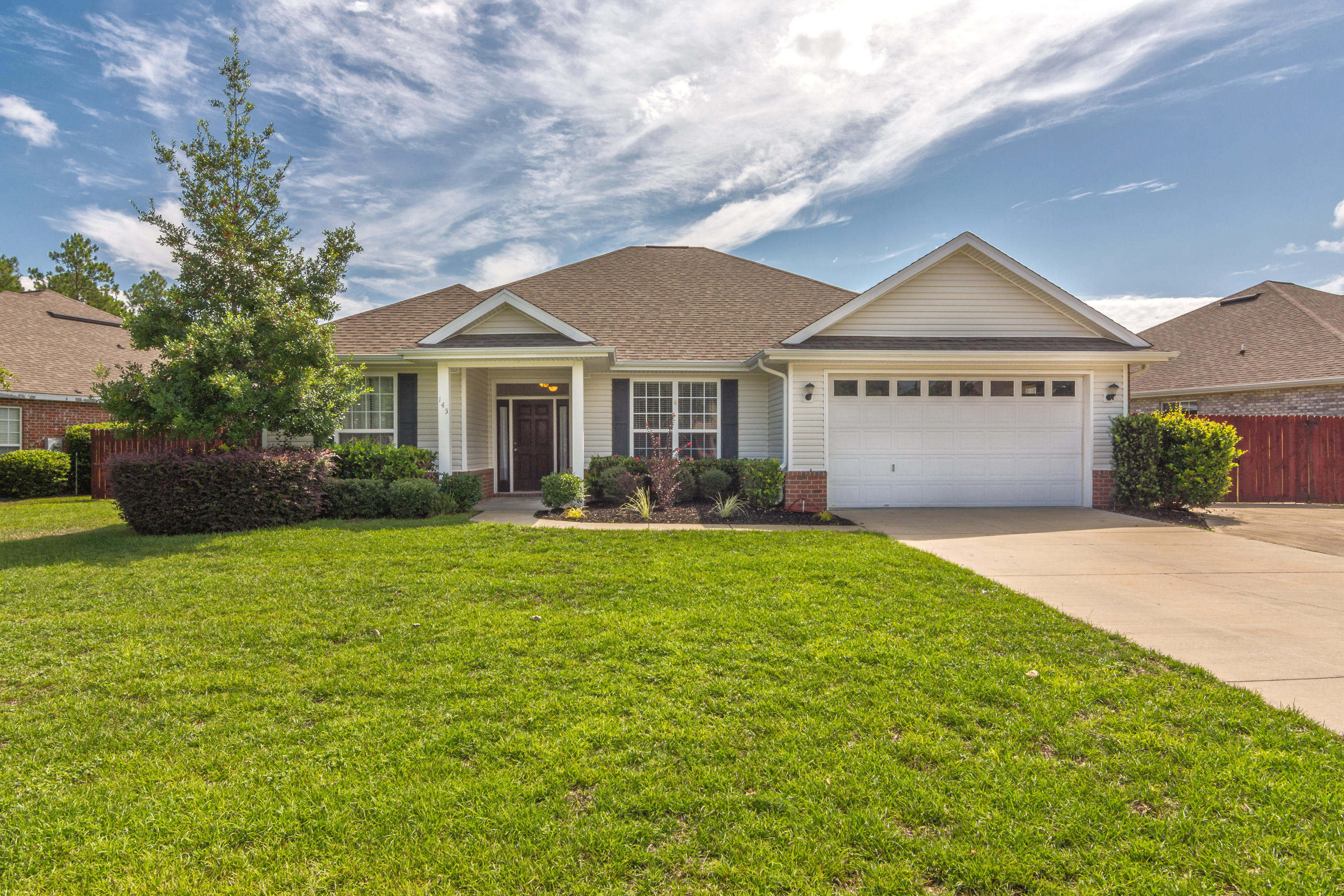 Stunning 4 bedroom 2 bath home located in South Crestview with easy commute to all the local bases, beaches, and shopping centers. Built by local custom builder you will right away notices the features including 36'' raised panel cabinets, crown molding, trayed ceilings, solid surface countertops and much much more. Large living room great for entertaining family and friends and rounding up the kids for a family movie night. Kitchen boasts plenty of cabinet and counter space for all your cooking needs. Master bath has a separate shower and tub as well as dual vanity. Let the kids and family dog play safely in the large fenced in backyard. Schedule your showing today!!!