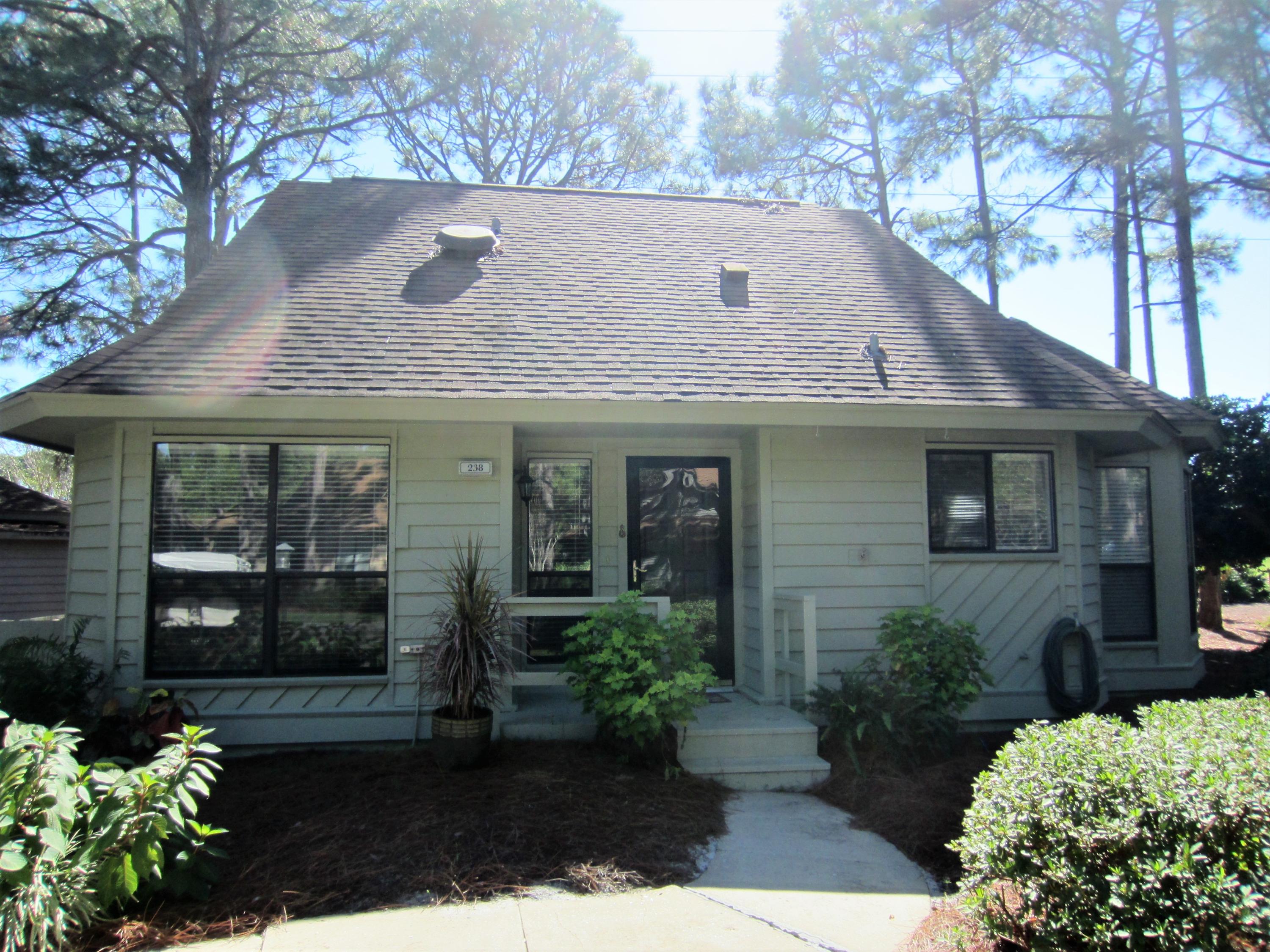 Tucked away amid tall pines and lush landscaping is this 3 bedroom/3 bath Florida cottage in Fairways located on the 5th hole of the Links golf course. The largest detached single family cottage (1800 sf) is being offered as shown. Remodeled kitchen with white cabinets and appliances, granite countertops, separate dining area, white tiled floors, wall-to-wall carpeting in bedrooms, 2nd floor master suite with adjacent den/tv room, double vanities in master bath, tiled and remodeled walk-in showers. Outdoor utility storage shed, hurricane shutters, PEX piping, interior painted in 2016, exterior painted in 2017, re-roofed in 2010 and an outdoor outlet for golf cart charging. The screened-in porch and back deck provide privacy and plenty of outdoor living space.