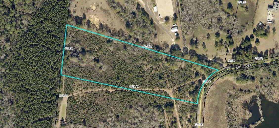 Beautiful 10-acre parcel located in Baker on a paved road with public water access and electricity access. Bring your chickens, horses and house plans.  There is at the rear of the property a small pond that needs to be repaired.  Love to go hunt? There is plenty of deer that has been seen on this parcel of land. There is adjoining to this 10 acres an additional 10 acres that sellers will consider selling as well if Buyers are looking for a 20 acre parcel of land.  The land offers a lot of privacy and definitely will make a beautiful homesite.  Call to schedule your showing today.
