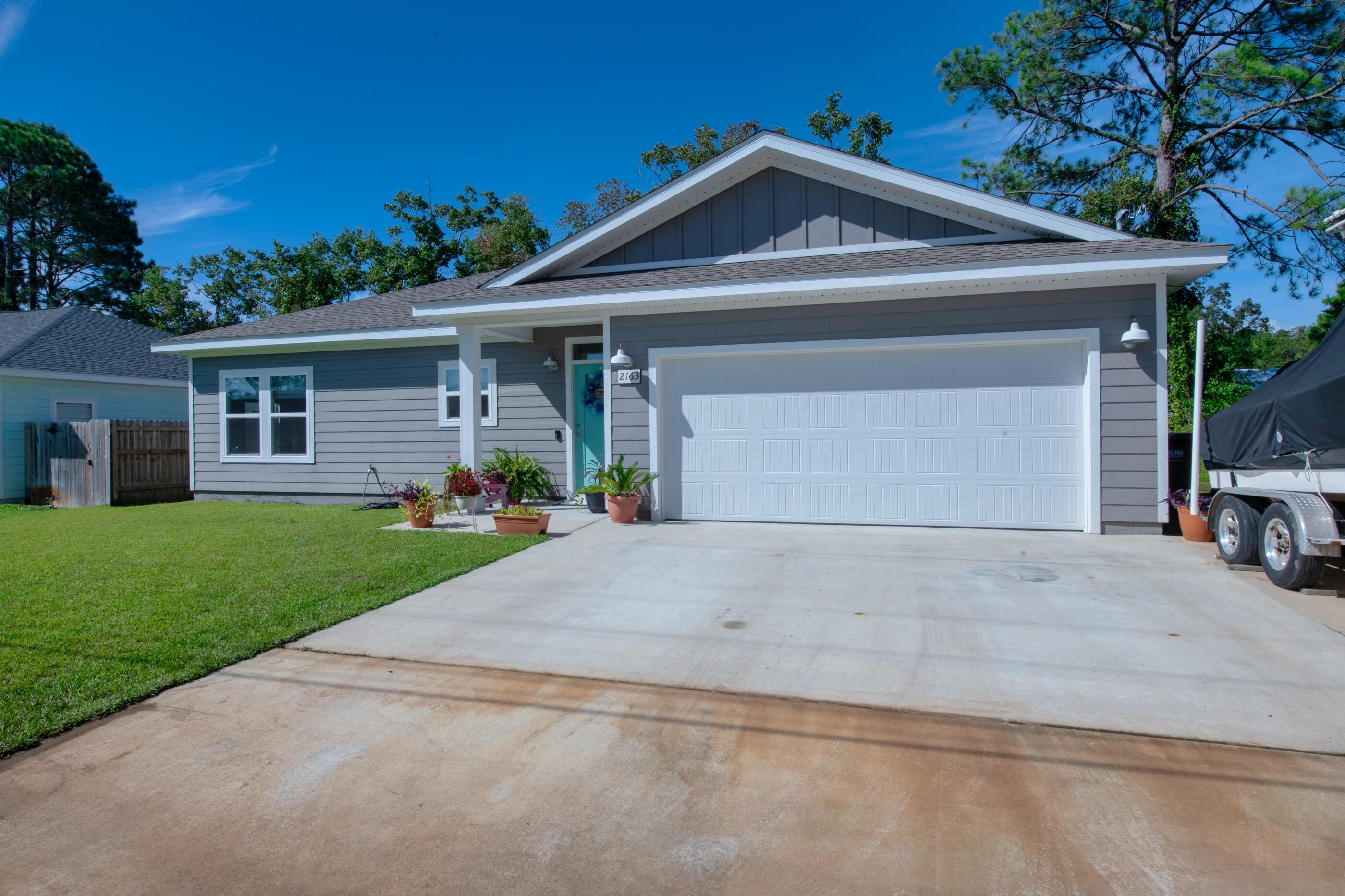 Beautiful home built in 2018. This split floor plan features plank wood-look tile flooring in the living areas and the carpet in the bedrooms were added for the perfect amount of warmth. The interior boasts Quartz counter tops, a walk-in closet in the master bathroom, a breakfast bar, Low E vinyl windows, and laundry room. On the exterior you'll find Hardy Board siding, a sprinkler system, fabric shield window protection, and additional boat or RV parking. 

The seller has a clean inspection report on the home,  a survey that can be provided- saving you money on closing costs!