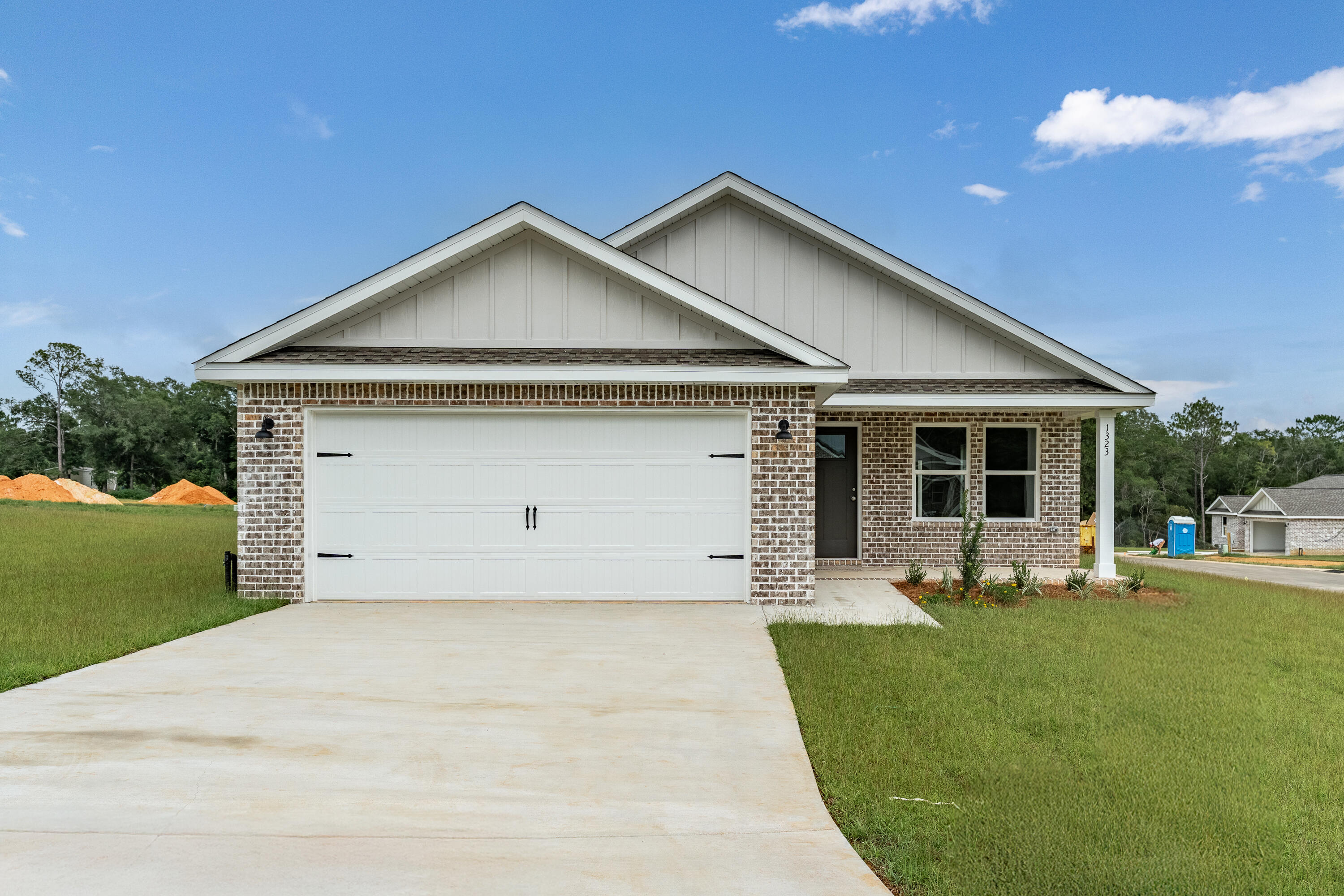 $15,000 ANYWAY MONEY FOR CLOSING COSTS/PREPAIDS/RATE BUYDOWN OR EXTRA APPLIANCES -''FRANKLIN'' FLOOR PLAN will be ready in late July -  Welcome to SOUTHERN DAY CHATEAU S/D IN BAKER FLORIDA! This all-brick home features raised ceilings, recessed lighting, ceiling fans thru-out, luxury vinyl plank flooring, granite or quartz countertops, sprinkler system for the beautiful, landscaped yard.  Front and rear porches for relaxing.  Kitchen has white shaker style cabinets, work island w/bar seating, cozy dining area, pantry and stainless-steel appliances.  Owner's bath has walk-in closet, double vanities, shower only.  Photo of similar completed home, interior/exterior colors will vary, front elevation may vary.