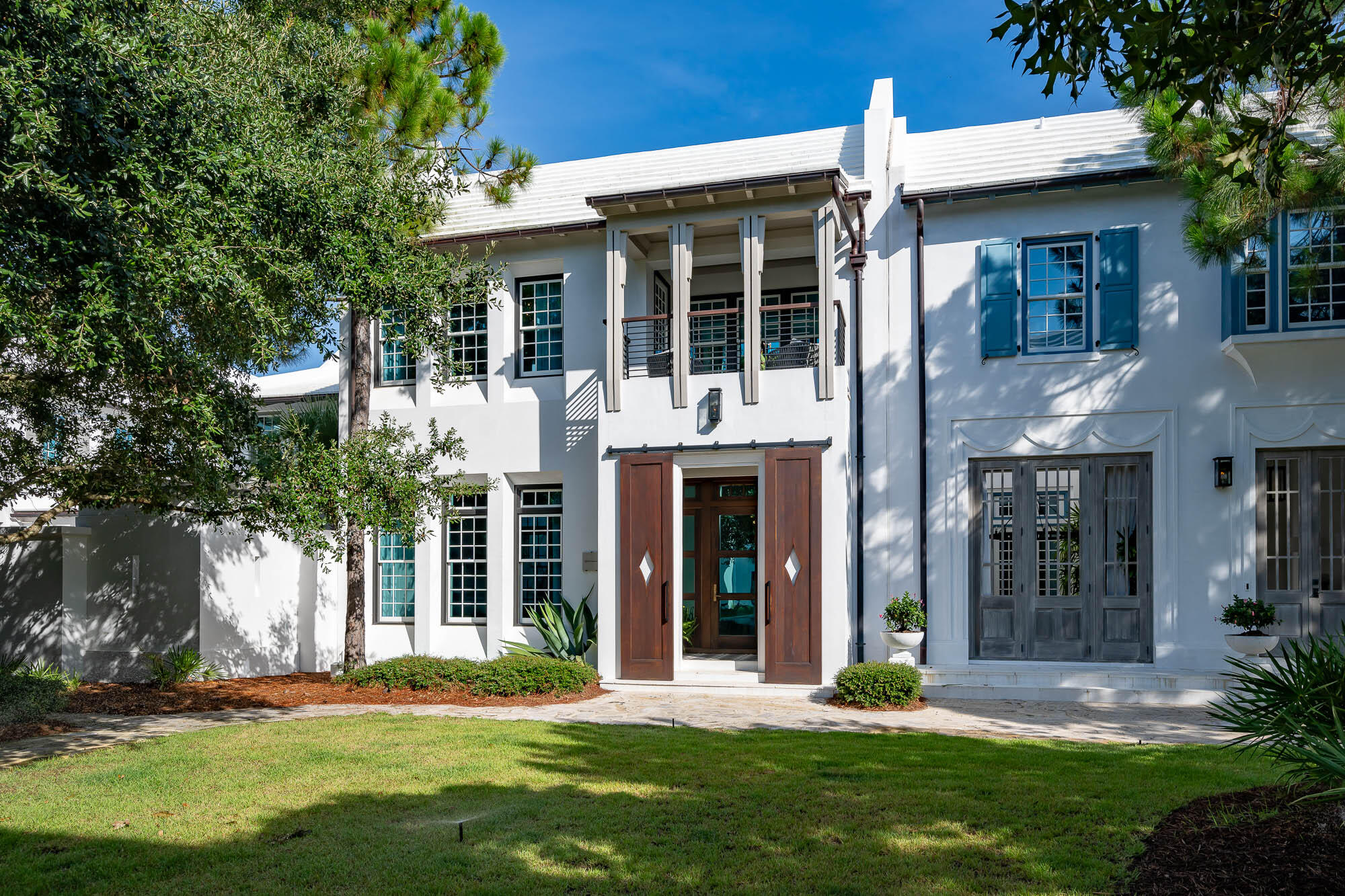 Welcome to Alys Beach's Arboleda Park and the highly sought after home offering of 32 Spice Berry Alley.  This masterful design created by Fouquet' Architecture solidifies elegance & sophistication intertwined to the beautiful entry setting on the famed Arboleda Park.
32 Spice Berry Alley creates intrigue & allure upon access framed by the stained mahogany entry slider doors giving way to the glass entry stoop. Architectural detail is noticed immediately upon entering the concrete cast zaguan providing a glimpse of what's yet to come.
This 3 bedroom, 3.5 bath home plus bunk room additionally yields a 2nd common area space for a separate retreat.  Pets are considered in design with a built-in kennel for those loved ones.  The 1st floor living captivates one immediately with open vistas of the living & dining rooms and the custom kitchen outfitted with Sub-Zero & Wolf appliances.  
Sightlines of the interior spaces are illuminated by the architectural design of the courtyard that provides natural light & beauty to these spoken interior spaces.  Courtyard living is an extension of your indoor amenities.  The aesthetics of pristine landscaping, decorated fountain wall, and fire pit surrounded by seating with summer kitchen create a favorable ambiance for outdoor entertaining.  
The custom designed kitchen hosts marbled quartz with leathered ebony natural stone on a multi-level island, modern wood grained cabinetry trimmed with a thick ebony accent. The upper cabinets are full overlay complimenting the Sub-Zero refrigerator and the Wolf range. Ascending to the second level leads you to an additional living/media room with adjacent custom bunks. Two junior primary suites flank the media room with ensuite private bathrooms each showcasing their own custom decor. 
The primary suite boasts an opulent entry hall with clear glass floor transoms accentuated by flowing natural light which overlooks the courtyard below. The truly unique details for this special home lie in the elegant primary suite accented with walnut floors and vaulted walnut ceiling. The spacious and exceptional primary bathroom invites you to separate double vanities, stand-alone soaking tub with separate Carrera marble shower. A separate make-up vanity was thoughtfully placed prior to entering the extremely generous custom designed master closet capable for full time living. Begin the morning or end the evening by sitting on the private terrace overlooking Arboleda Park.  
32 Spice Berry Alley is strategically located near The Caliza Pool, Zuma Wellness Center, and Town Center.  The private owners Beach Club access conveys with the purchase of this magnificent home.  This property is a must see.
