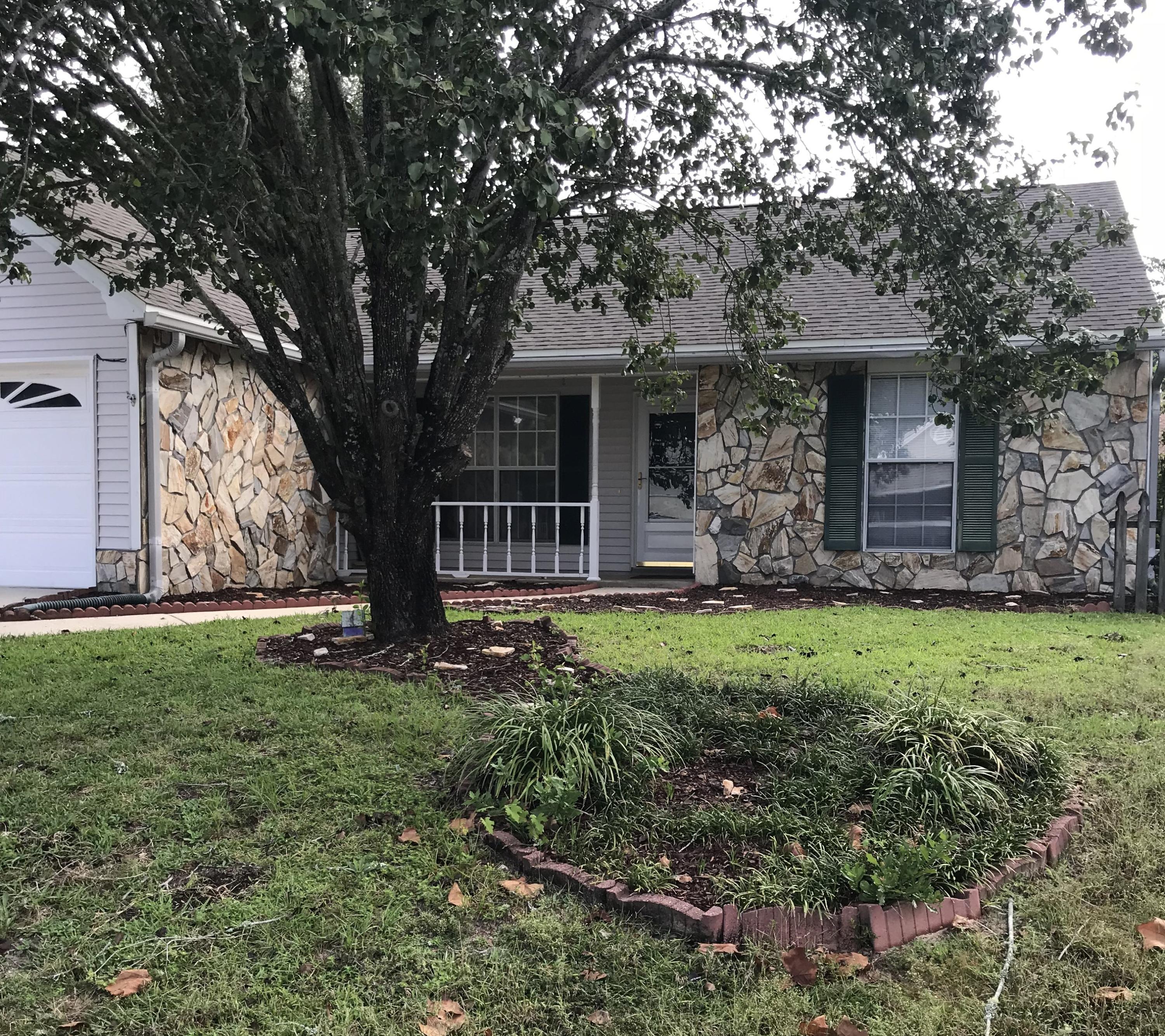 Cozy family home in Blue Pine Village. Popular 3 bedroom, 2 bath split bedroom floorplan with screened porch and two car garage. Enjoy the screened porch while the kids play in the fenced back yard. Neighborhood has community pool and is close to Bluewater Elementary school, and the Shops at Merchants Walk. Owner will consider a pet with a $300 pet fee. Pet must be spayed/neutered, up to date on shots, and at least a year old and fully housebroken. Call today for your showing appointment.