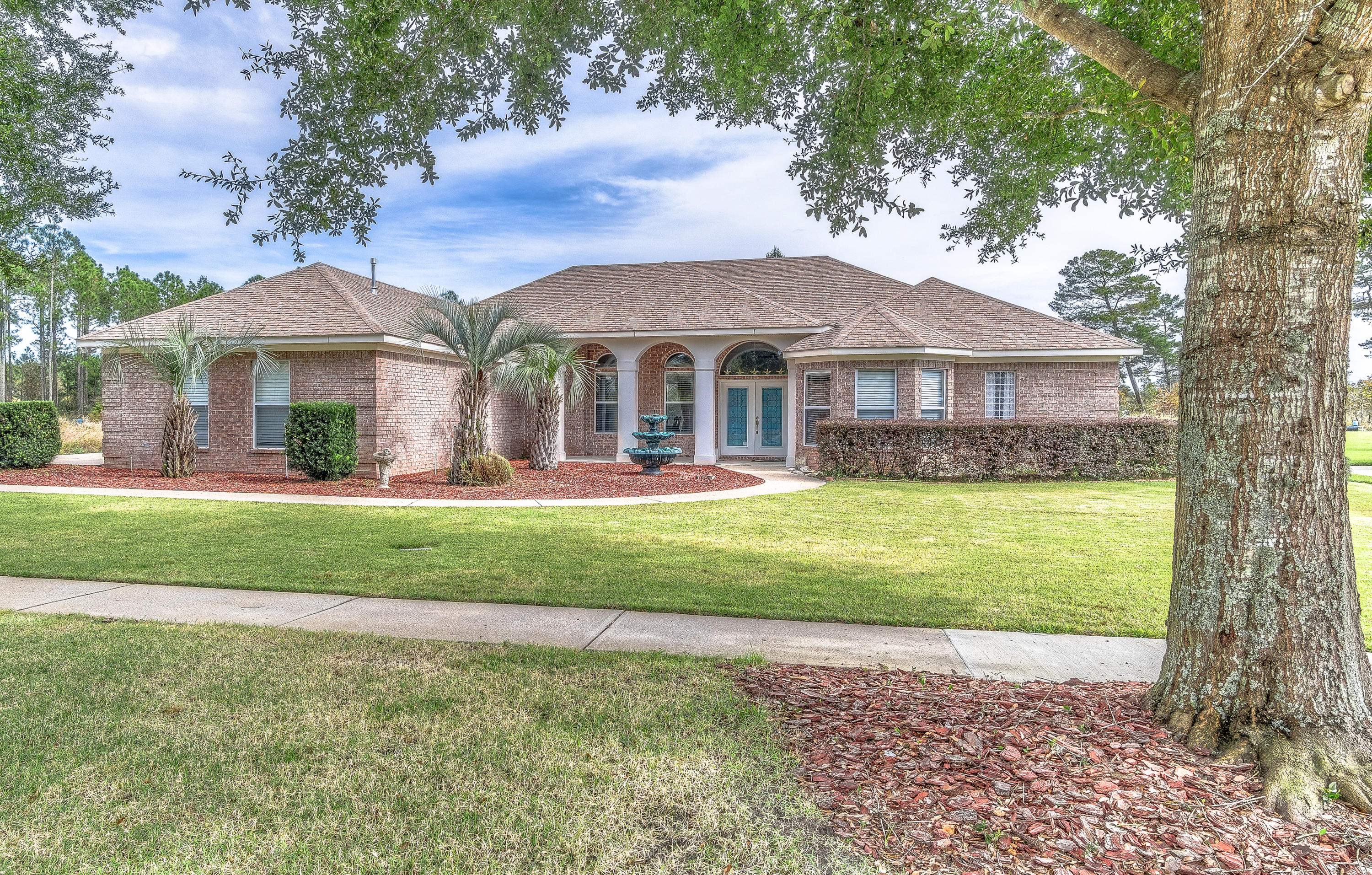 IMMACULATE MUST SEE HOME!! This beautiful estate size property is located in the charming gated community of Windswept Estates, situated directly on Fairway #1 of a 4 star golf course as rated by Golf Digest. The community is located just a little over 5 miles to the new Publix shopping center in Freeport and roughly 35 minutes from the Northwest Florida Beaches International Airport and 25 minutes to the Bay, 35 minutes to the nearest beach access in Blue Mountain.
This gracious retreat features a split floor plan, beautifully landscaped yard, hot tub, outdoor gas grill, fenced in back yard, a spacious master suite, formal dining area, granite countertops, island, double ovens, custom cabinets, Shaw Hardwoods Cambridge Merbau engineered long strip flooring, tile in bathrooms, built-in ,carpet in bedrooms, billiard room, 3 car garage, sufficient attic space, tall ceilings, crown molding, and big laundry room all while providing ample privacy to create the perfect oasis.

Recent Updates Include: New Interior Paint, Stain Master Pet Protect Battle Creek White Wash Carpet with 1/2" Spill Guard Pad, quiet garbage disposal, tankless gas hot water heater, semi-frameless shower door, and a 39 decibel quiet dishwasher. 


 You can really have the best of both worlds; quiet and seclusion yet just a short drive to all the action (shopping, dining, and entertainment) of the emerald coast and 30A. Previous survey is available. It's a MUST SEE!