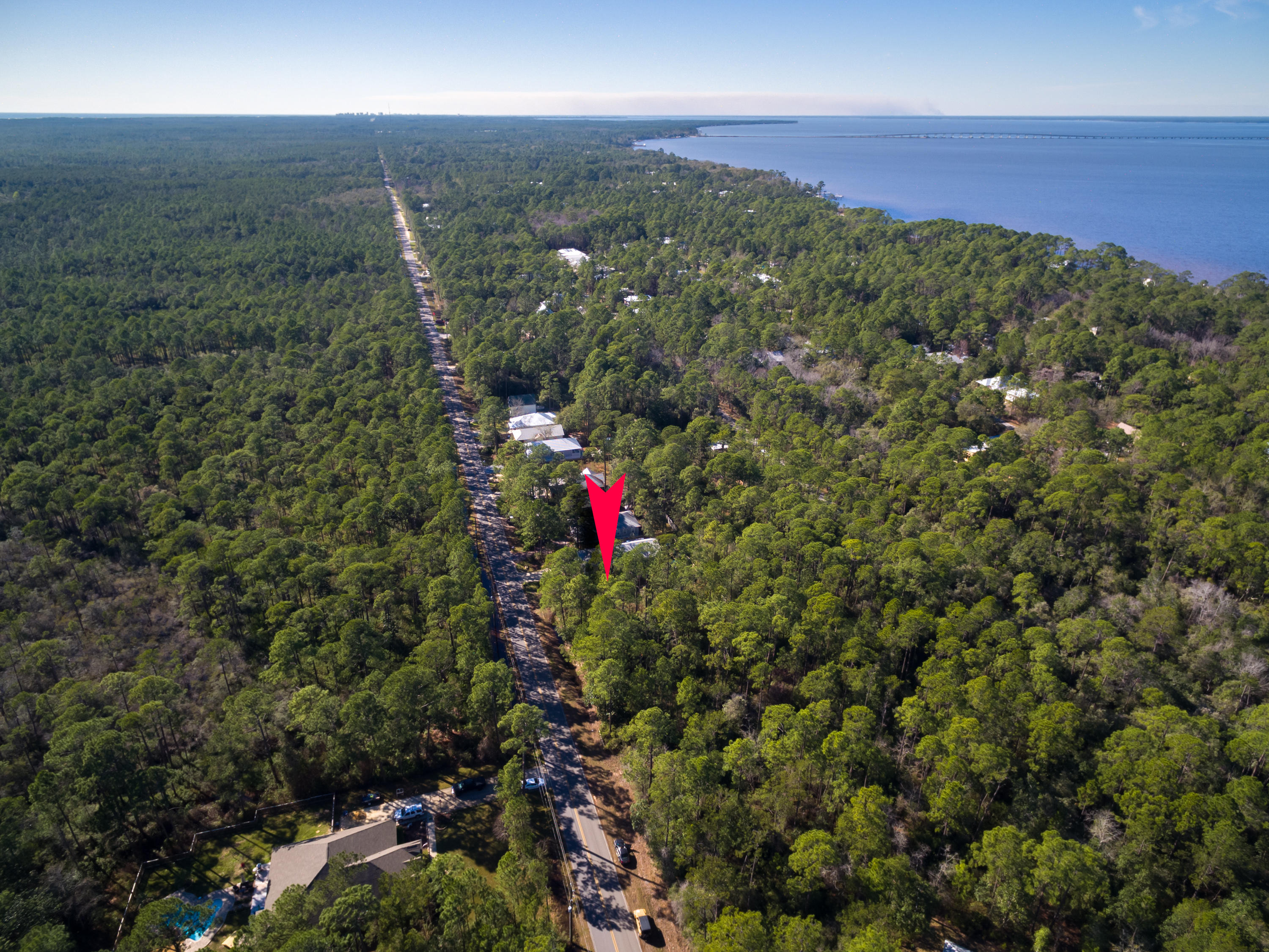 An excellent location with nearby bay access to build your home in Point Washington - just a few minutes drive from Grayton Beach, Watercolor, and Seaside - yet offers a more private and personal bay-living lifestyle. Point Washington is where the 30A locals live and grow their families.
This lot is wooded and believed to be free of any wetlands and ready for partial or complete clearing for your custom home build. As part of the Magnolia Beach neighborhood - no mobile homes are permitted. Please see other homes in neighborhood for examples of what is expected and permitted. Beautiful family homes, paved streets, as well as a neighborhood bay access is awaiting in this neighborhood. Drive by lot and neighborhood yourself. All details and due diligence to be completed by buyer.