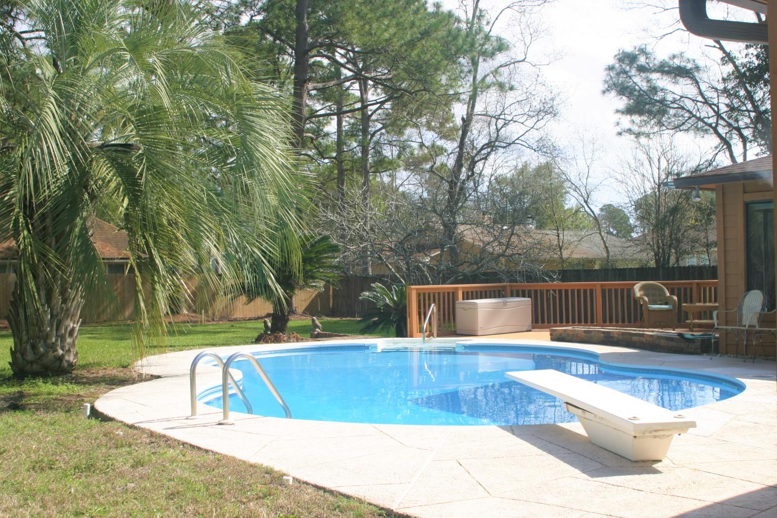 Welcome to a tastefully done ranch style single story home. As you enter, it opens into the family room where you will see the stone gas fireplace with hearth and window to the pool. The nook and kitchen are right ahead with granite counter tops and stainless steel appliances. There is a pass through that goes to the Florida room. The Florida room comes complete with a wraparound bar, padded rail and foot rest. This space is great for meeting and relaxing after a dip in the in ground pool. Next you will see the 3 bedrooms, 2 baths, which are spacious. Flooring consists of some hardwood, tile and wall to wall carpeting. The backyard is set up for entertaining with a large freshly painted wooden deck and plenty of Kool deck around the pool. Backyard is huge; plenty of space for family gatherings. Several mature Palm trees plus a Fig tree grace the backyard.You can make all of this yours today. A must see property