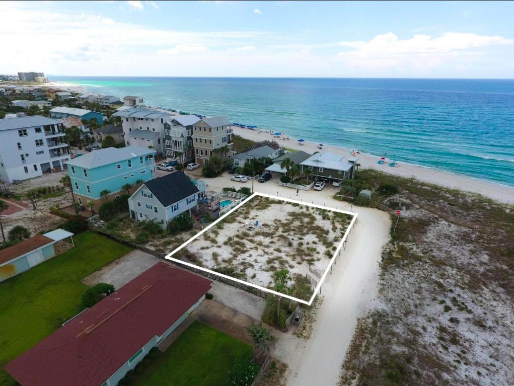 BUILD YOUR DREAM BEACH HOME with FOREVER GULF VIEWS on this lot off the beaten path in Inlet Beach. 000 Emerald Cove, is located one tier back from the Gulf, offering expansive views of its emerald waters and gorgeous beaches. There is a unique opportunity to purchase this lot along with the home next door which offers great rental potential. With no HOA fees or community dues, this area allows the flexibility for you all to take your time with building, to ensure you create the home of your dreams.
This lot is conveniently located near the new 30Avenue shopping center, as well as the nearby to local communities such as Rosemary Beach where you can enjoy entertainment and activities perfect for family and friends. The Pier Park shopping center is less than 10 miles east of this area, and includes shops, dining, a movie theater, and more! 

Buyer is responsible for personally verifying details about this property. Any information contained in this listing is believed to be accurate but is not guarantee