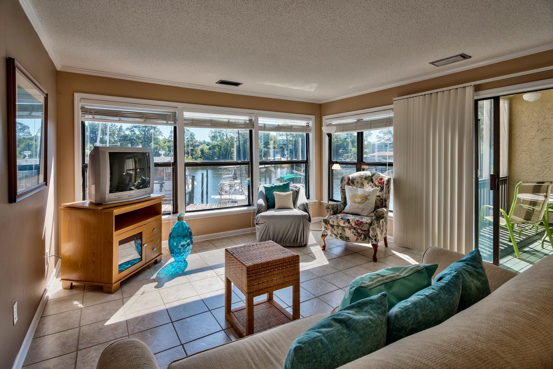 YOU'VE FOUND IT! THE WATERFRONT LIFESTYLE YOU'VE ALWAYS DREAMED PLUS YOU COULD HAVE PART OF YOUR MORTGAGE PAYMENT COVERED. Imagine after a long day's work, relaxing on your waterfront patio & then jumping into your boat for a sunset cruise as you leave all worries behind. This can be your lifestyle as this TWO unit waterfront condo allows you the opportunity to live in one unit and rent out the other one to offset your monthly mortgage payment. Located steps away from the marina, boat slips are available staring at just $10/foot. Offering a one bedroom,one bathroom unit on one side w/a large great rm, dining area, kitchen w/granite & waterfront screened porch, and an efficiency apartment on the other w/kitchenette, bathroom & waterfront deck, your options are numerous. Both short & long term rentals are allowed and this condo routinely generates $26,400 annual rental income.  Located in the heart of Bluewater Bay, tennis, golf & the community pool are close by.  Come see this waterfront opportunity for yourself today.