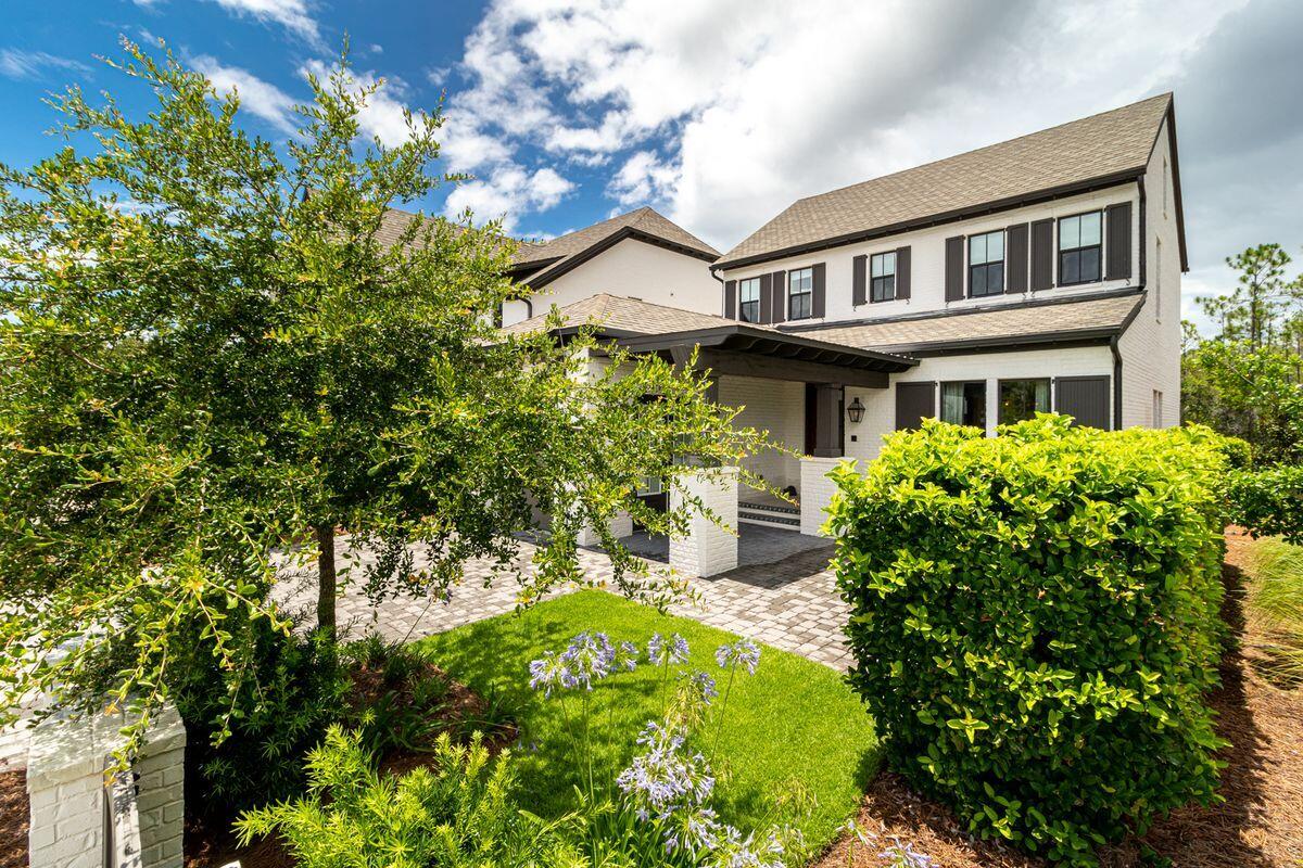 Splendidly located in a gated community at the quieter west end of 30A, this nearly new home was completed in 2017. Conveyed fully furnished, it even comes with a four-seat GOLF CART for getting to the community pool and pavilion. Ed Walline Park and the white sandy beach are less than a mile from the door. An attractive paved driveway leads to the garage and covered loggia-style entrance. Spread over two floors, this well-planned residence has a family-sized living room with quality wood flooring and large windows introducing ample natural daylight. Beyond the formal dining area, the gourmet kitchen has Shaker-style cabinets, a pantry and a central island for casual dining, drinks and snacks. Shiplap walls and natural wood flooring adorn the master suite as a nod to the natural views  outside. The generous master bathroom is located located on the first floor with its oval garden tub, double vanity and gray tiled shower exude a cool ambiance. Three further bedrooms include a second master suite (one on each floor) and a cabin bunk room creating a fun den for youngsters. Step outside into the screened rear porch and enjoy the peaceful surroundings and sounds of nature. Beyond the generous yard, the lush 6.5-acre conservation area provides a sense of privacy and tranquility for evening drinks and barbecues. This modern home includes state-of-the-art smart technology, a security system and surround sound speakers on the back porch. Ideally located as a permanent home within easy reach of the beach and local amenities, this turnkey home is in a non-short-term rental community. With a large neighborhood pool with hot tub, fire pit and footpath to the beach, this nearly new home is hard to beat.
