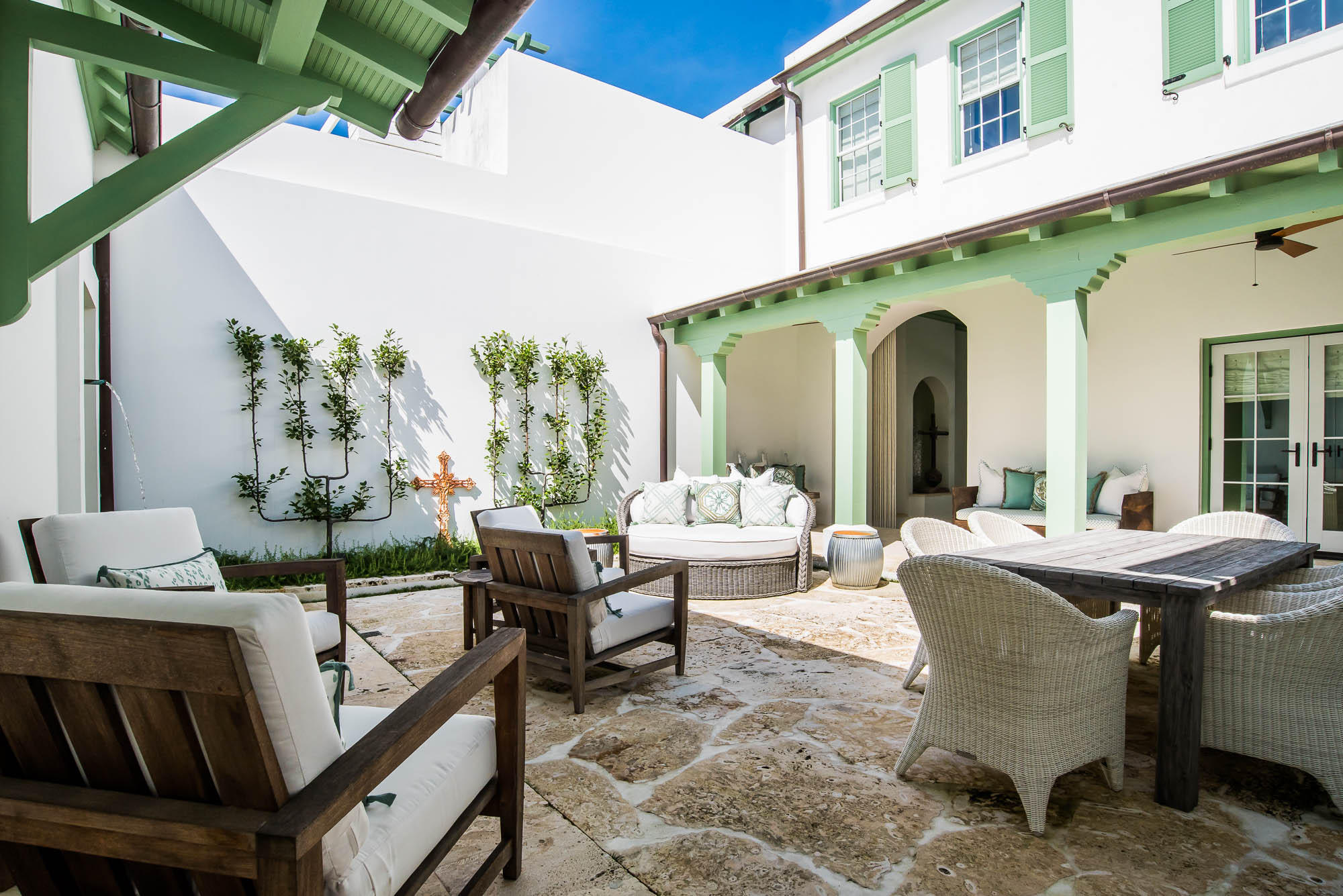 This inviting design by Steve Mouzon captivates you immediately upon entering the Zaguan entry to the courtyard. Upon passing through the nautical rope curtain to the courtyard, you feel as if you were lifted to a new dimension.
This 3 bedroom, 3.5 bath, 2,584 square foot courtyard home provides indoor & outdoor living experiences like none other. The breath taking first floor master bedroom provides privacy from the common areas of the home allowing for complete relaxation.
The home features an open kitchen looking over the courtyard. Natural light transcends the home showcasing the beautiful reclaimed Red Gum cabinets and wood inlays throughout the home. The kitchen is equipped with Thermador stainless steel appliances, limestone countertops and custom red gum cabinets. The outdoor grill is steps from the kitchen.

The details of the home need to be viewed to see features such as the Bishop's Hat vault over the dining table.  

The living area and dining room open to the private courtyard with lush landscaping and soothing fountain.   The courtyard living is unforgettable given its array of furnishings, landscaping, and fountain.  

The second floor offers two generous bedrooms with private baths along with a quaint reading nook at the stair landing. . Built to FORTIFIED for Safer Living® standards the home is located very close to Fonville Park and a short stroll to the Gulf Green.  This property is being offered with professionally installed furnishings.