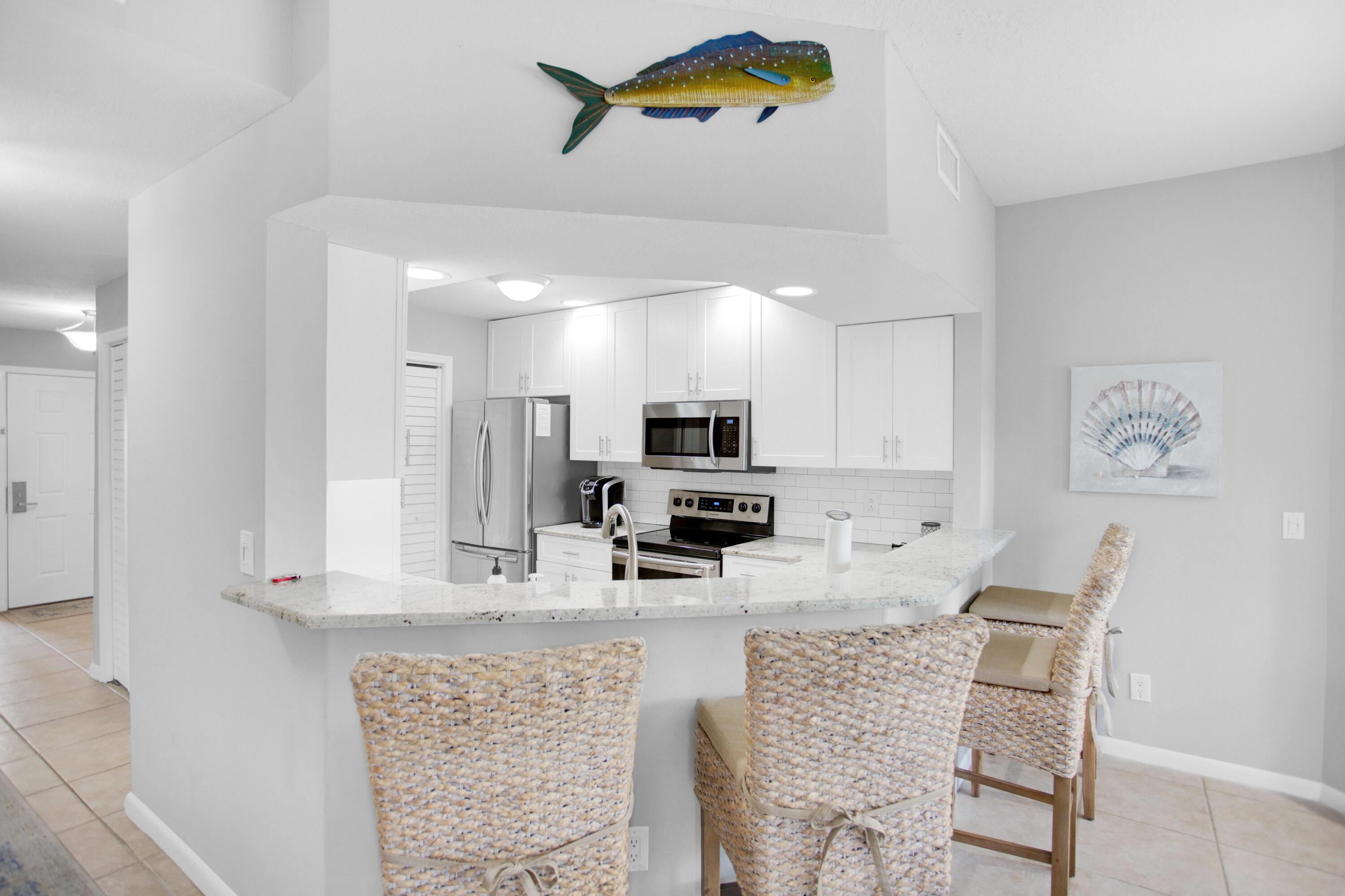 Remodeled, first floor, single story condo located on the 15th fairway of Baytowne Golf Course. 4-seater 2018 Star Golf Cart included! This home is bright, spacious, and perfect for a full time residence, vacation home or rental property. New HVAC 2017 and water heater 2016. Completely renovated kitchen & baths, stainless steel appliances, neutral grey painted walls, and coastal furnishings. Both bathrooms offer a double sink vanity and new walk-in showers. The large dining/living area offers a perfect space for family gatherings with two doors leading to the screened in patio. Also enjoy extra sleeping with a newly added hallway bunk area. Great location across from the Tivoli community pool and within 1/4 a mile to the Sandestin public beach access. As an introduction to the Sandestin lifestyle, we invite our new owners to explore amenities that make Sandestin special. The listing brokerage and seller(s) are presenting the buyer(s) of this property with (2) 90-minute rounds of Tennis court time, a golf foursome at one of our three championship courses, and a round of golf for up to four (4) players at the unrivaled Burnt Pine Golf Club.
Sandestin Golf and Beach Resort features more than seven miles of beaches and pristine bay front, four championship golf courses, 15 world-class tennis courts, a 226-slip marina, a fitness center, spa and celebrity chef dining. Shop, dine and play at the charming pedestrian village, The Village of Baytowne Wharf and more. Inside the gates of the resort, residents enjoy a balanced lifestyle of high-class living, spanning the 2,400 acres from the beach to the bay. Everything within the gates of the resort is accessible by golf cart or bicycle. The entire resort is interconnected by miles of pedestrian, bike and golf cart paths that weave through groves of live oaks, meandering past natural lagoons, fountains, man-made lakes, and meticulously landscaped fairways.