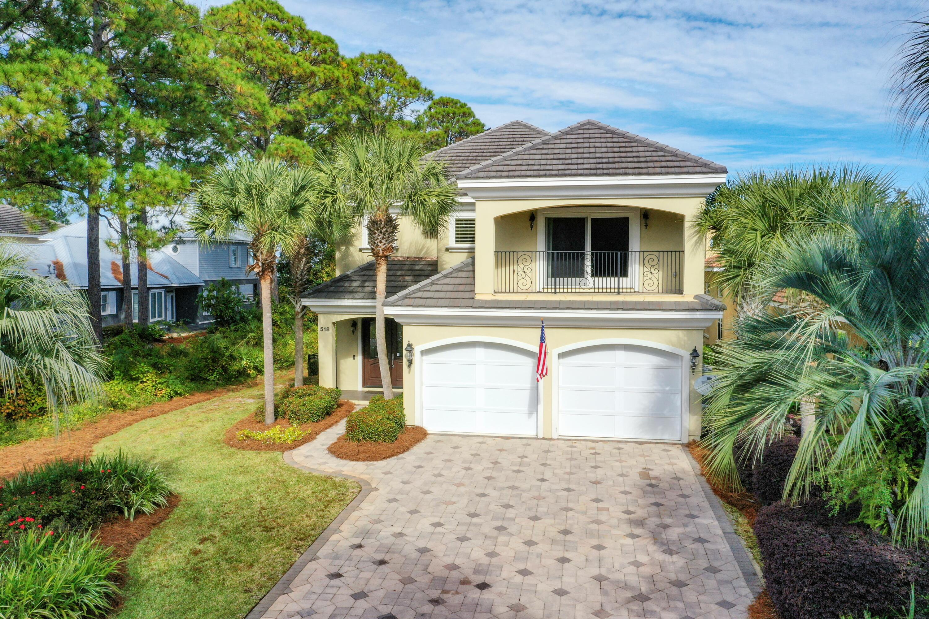 BONUS: the most amazing dock on the Bay in Miramar Beach! This 2 story home features an open concept living area with a gas fireplace on the first floor along with kitchen, dining, half bath and laundry. THERE IS A MASTER SUITE ON EACH FLOOR. The 2 additional bedrooms are generously sized each with it's own private bath. The 2nd floor includes a large recreation room with wet bar/refrigerator and balcony overlooking the Bay which could be a 5th bedroom.  Built by award winning builders, Dixon Kazek Construction (DKM Custom Homes) this home features traditional hard coat stucco exterior, cement tile roof, built in pest control, icynene attic insulation & a slab elevation at 10.26 feet above sea level. The current owner added solar panels for additional energy efficiency. All ceilings are adorned with crown molding while the entire home & garage features 7'' base board. Large kitchen is a chef's delight and is highlighted by a surround breakfast bar open to dining area & great room & includes stunning 2 tone custom cabinets, granite counters, mosaic backsplash, GE profile stainless appliances, wine refrigerator & walk in pantry. Screened lanai features heated pool/spa surrounded by pavers & summer kitchen with stainless grill, ice maker & prep sink. Spacious fenced backyard overlooking the bay with seawall + rip rap, dock with water and electricity, covered boathouse with 8,000 pound lift. There is also an upper level sun deck, screened dock house with icemaker and refrigerators and fish cleaning station.  Quality construction, custom appointments and outstanding location make this the perfect selection!