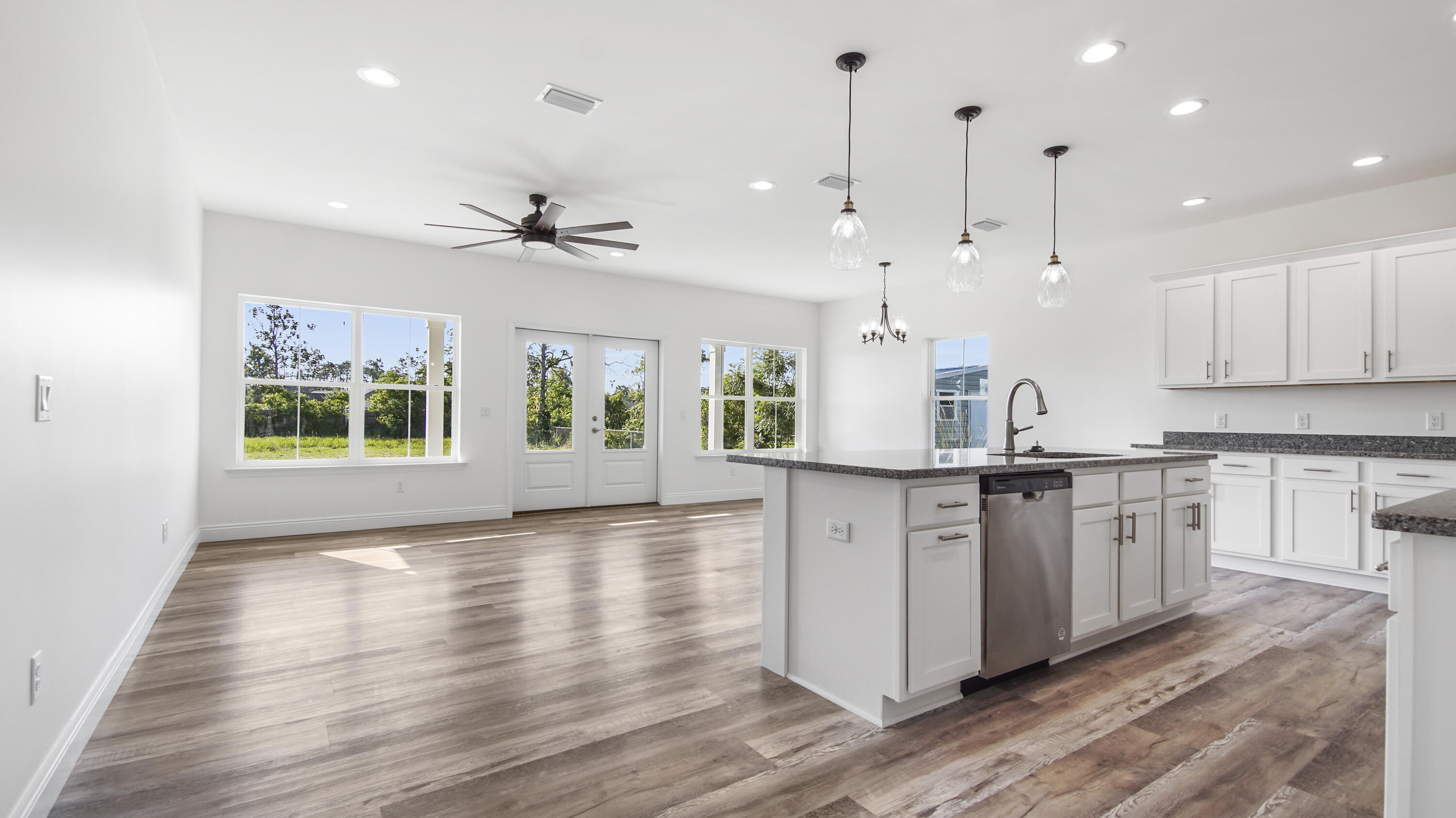 FABULOUS OWNER FINANCING AVAILABLE! NEW CONSTRUCTION - Beautiful 2 Story Home. 3BR/3.5 BA W/Office. boasting 2388 sq ft of living space with a 2 car garage as well as large driveway. Great for Tyndell AFB workers. From the moment that you walk up to the inviting front door and step inside you will feel right at home. Foyer area to the main area is wider than most homes. Open floor plan with a neutral color palet, all stainless appliances, qranite countertops, custom cabinets, luxury vinyl plank flooring, and designer lighting. Master suite, Living area, kitchen, office, 1/2 Bath and laundry are on the first floor. Master suite has 2 closets leading into the fabulous master bathroom with a beautiful oval tub, separate shower & double vanity with granite countertops. Lots of windows for natural light leading to the backyard lanai. Both bedrooms upstairs have private bathrooms & private balconies for you to enjoy your morning coffee or evening beverage & watch the sunrise and the sunset. Home sits across from East Bay with great views of the water from your balcony. Step out on the spacious lanai to your large back yard. Perfect for you to add a pool, a garden, kids play area & your own landscaping design. Great for entertaining. Don't miss out on this one. The home next door at 913 Plantation Dr is also new construction for sale, mostly completed and the floor plan is a flip flop of this home. Homes back up to Plantation Point.
